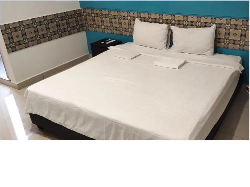 Bed in Grand FC Hotel