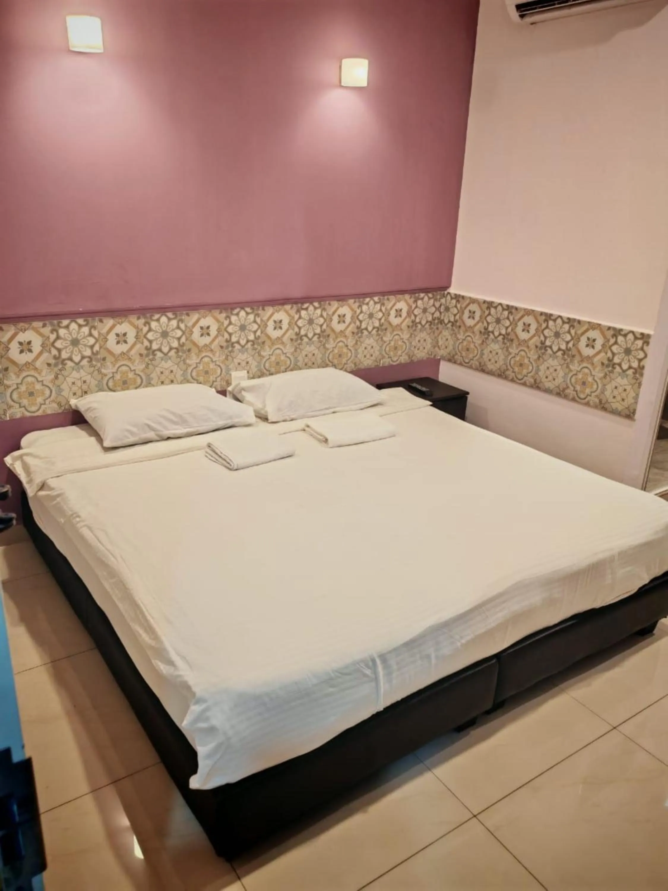 Bed in Grand FC Hotel