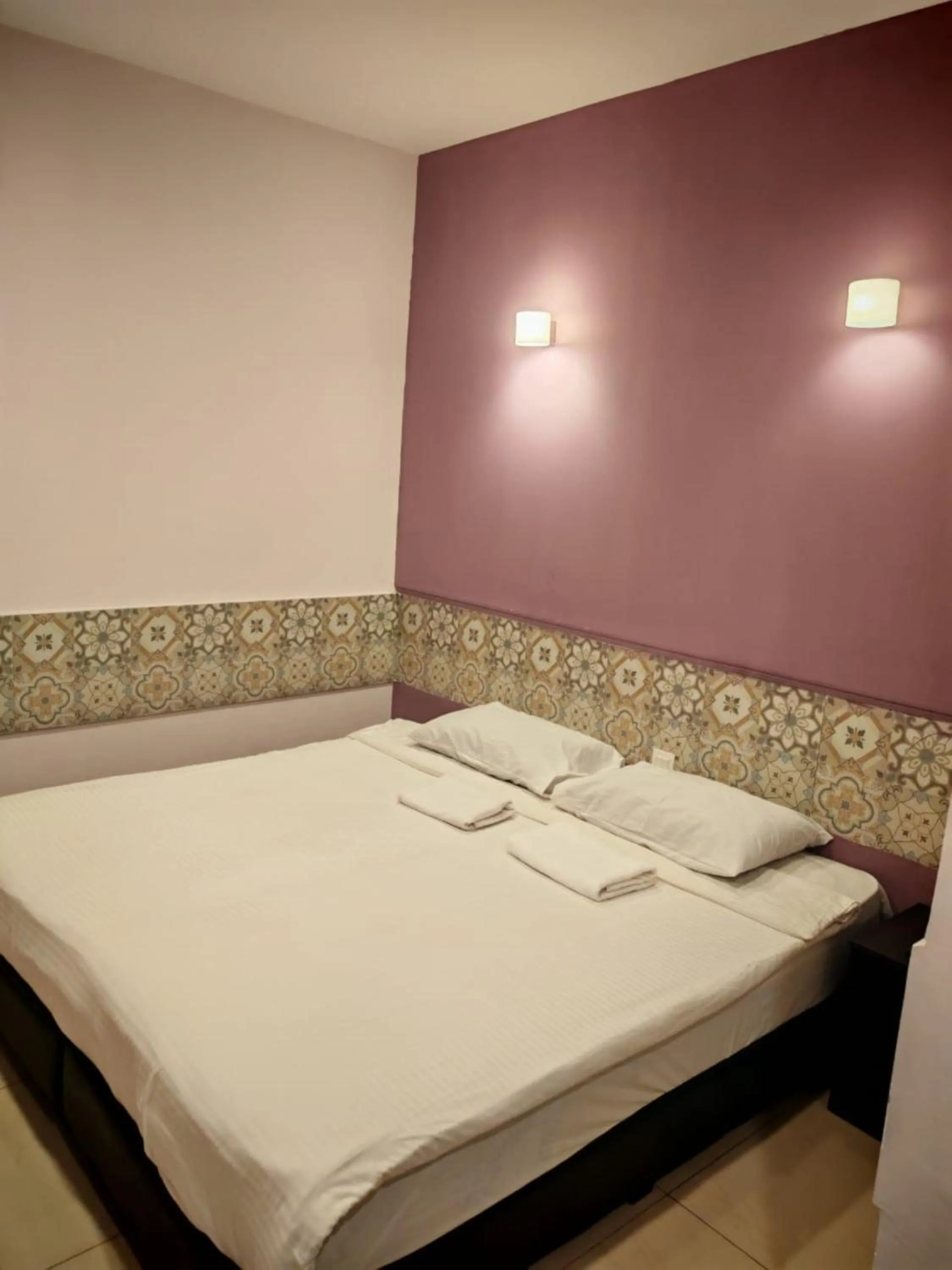 Bed in Grand FC Hotel