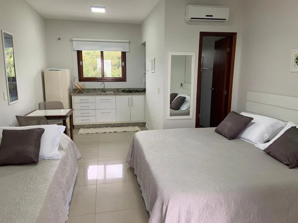 Bed in Pousada Mar de Cristal