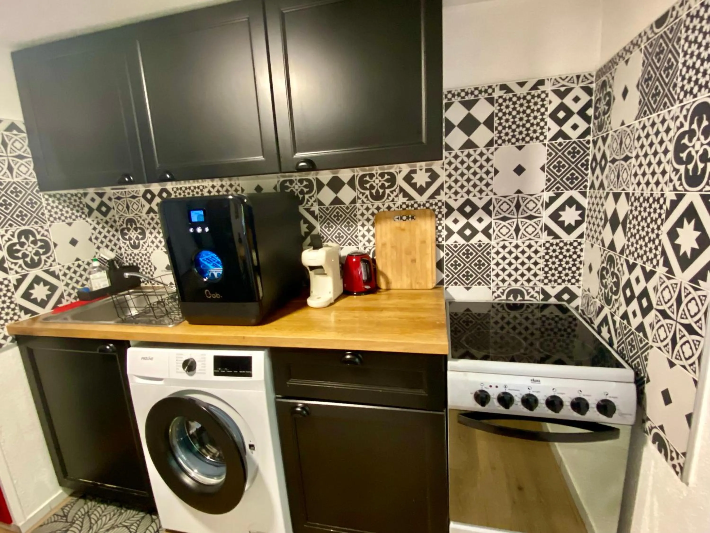 Kitchen or kitchenette in Appartement de caractère au calme 15 mins quartier historique, Gîte du Merlenchanteur