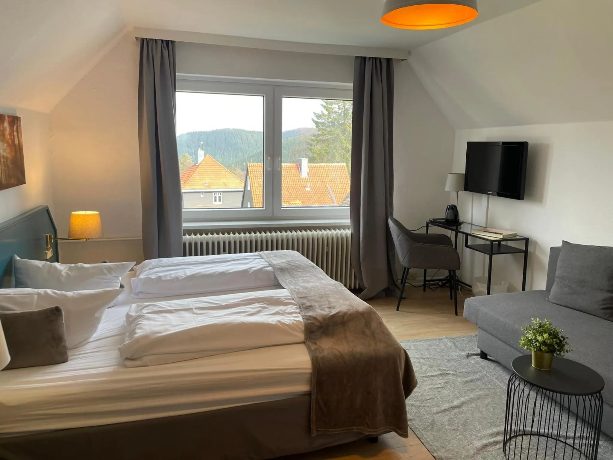 Photo of the whole room, Bed in Berghotel HARZ