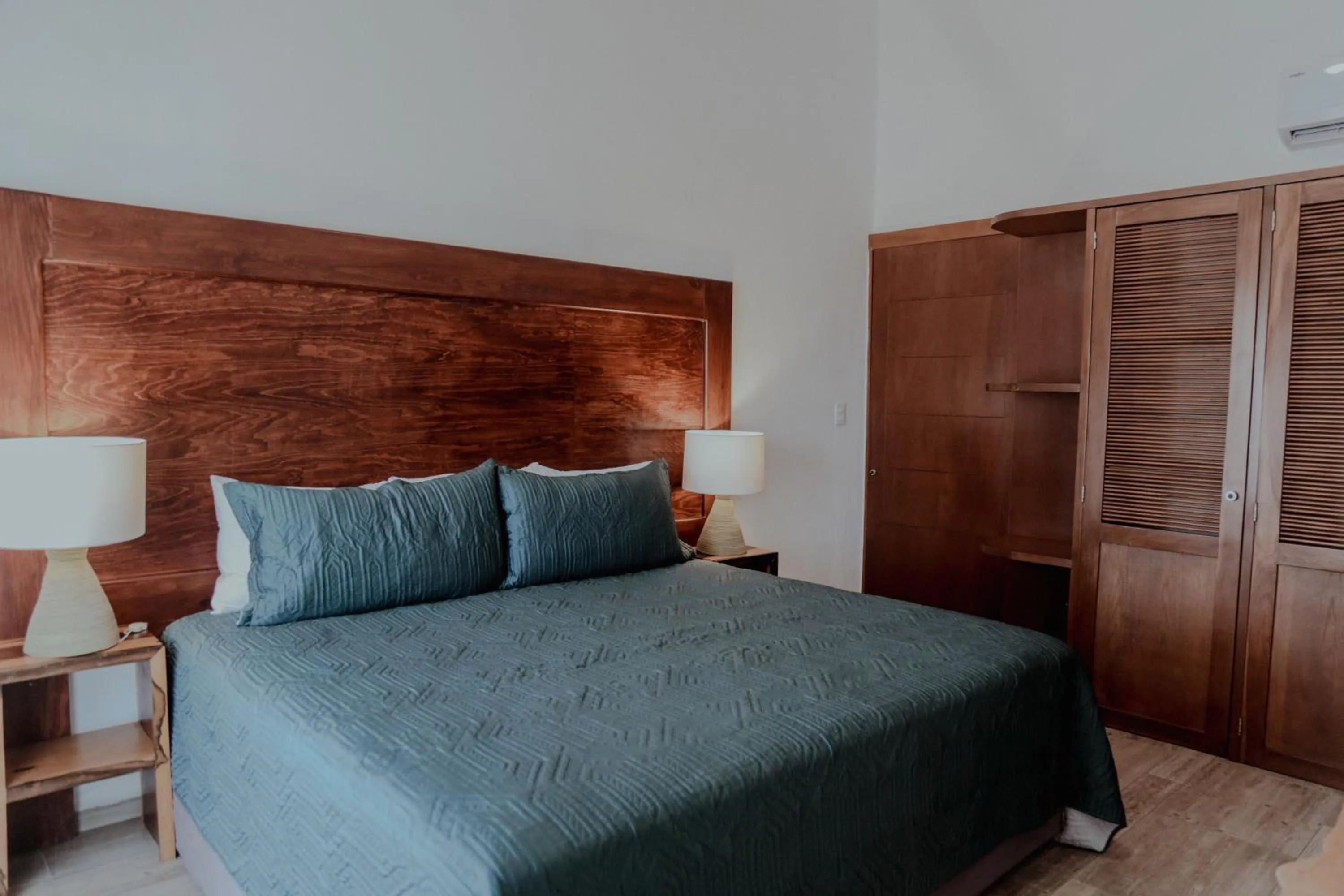 Bed in Fabiola Condo Hotel