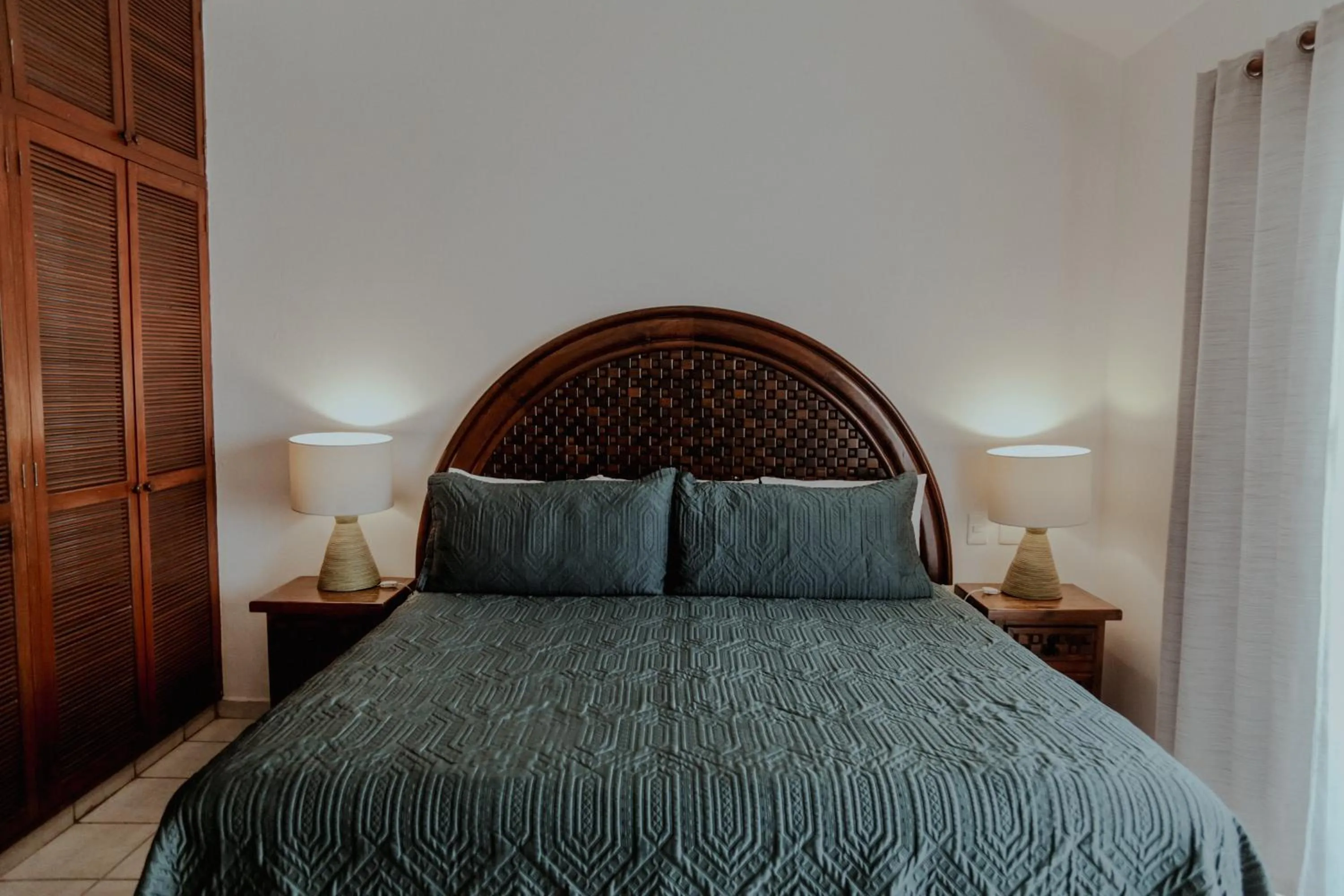 Bed in Fabiola Condo Hotel