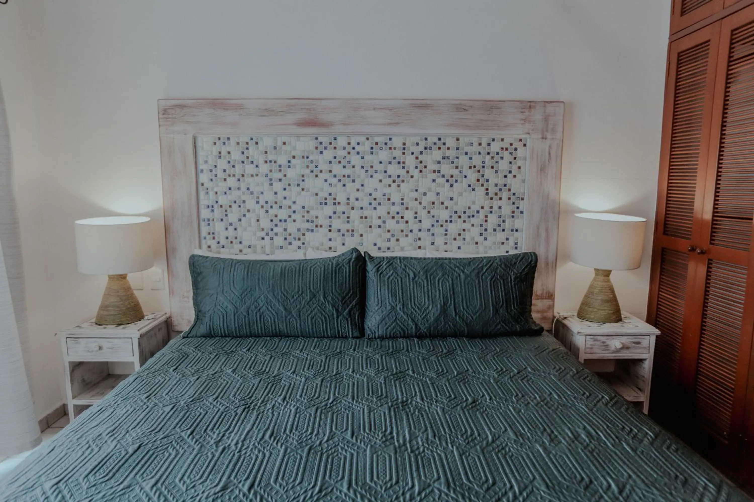 Bed in Fabiola Condo Hotel