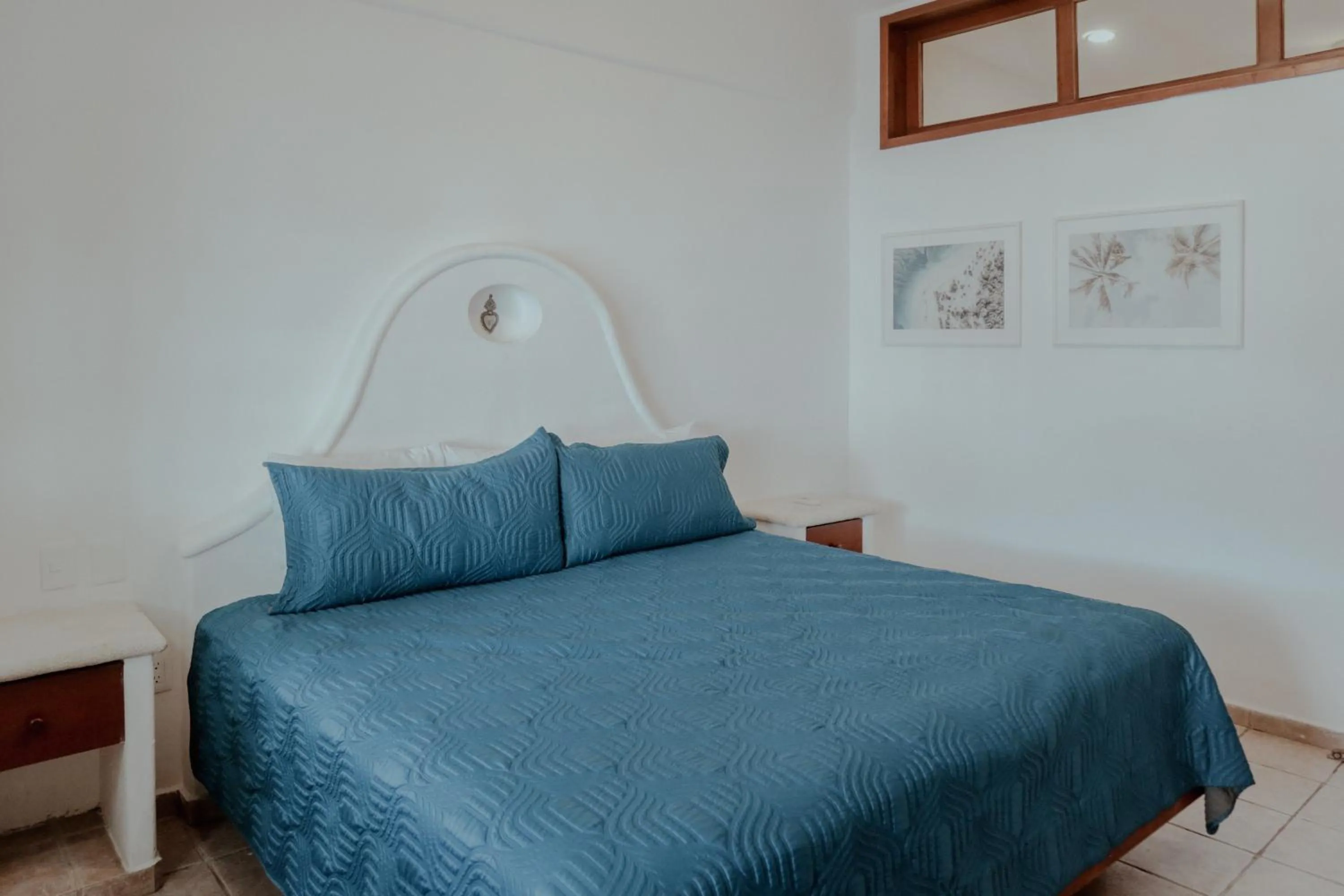 Bed in Fabiola Condo Hotel