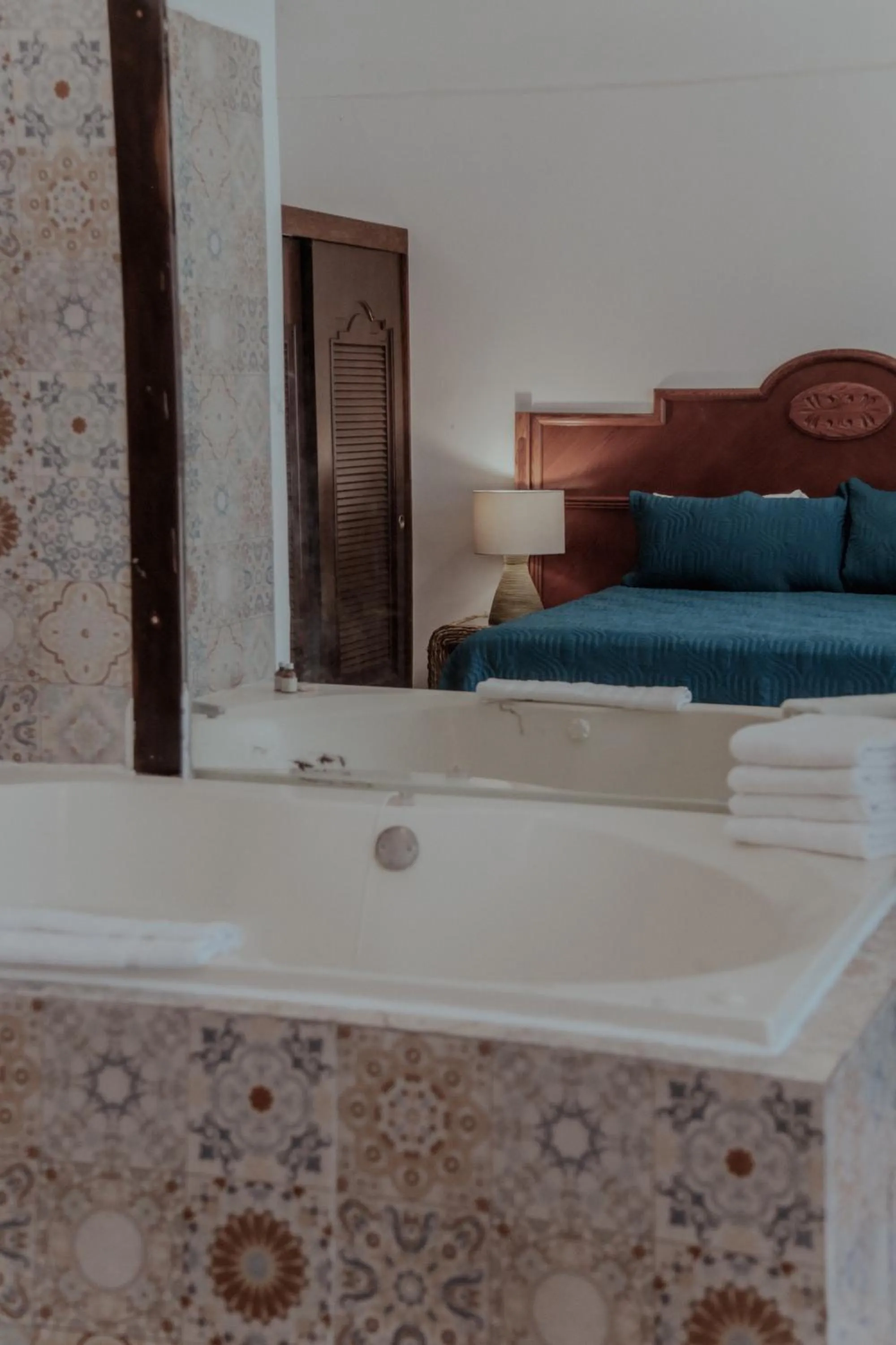 Bed in Fabiola Condo Hotel