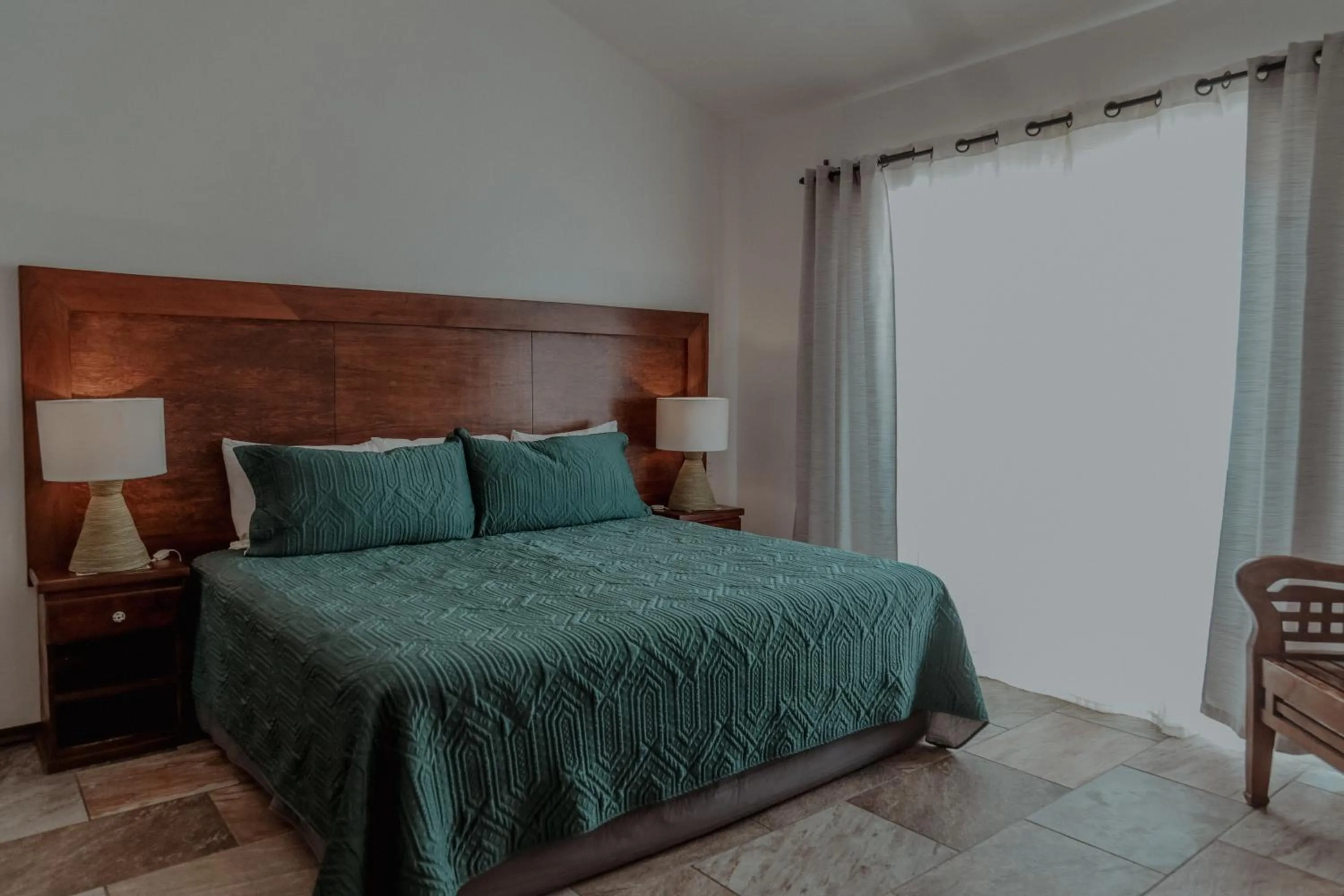 Bed in Fabiola Condo Hotel