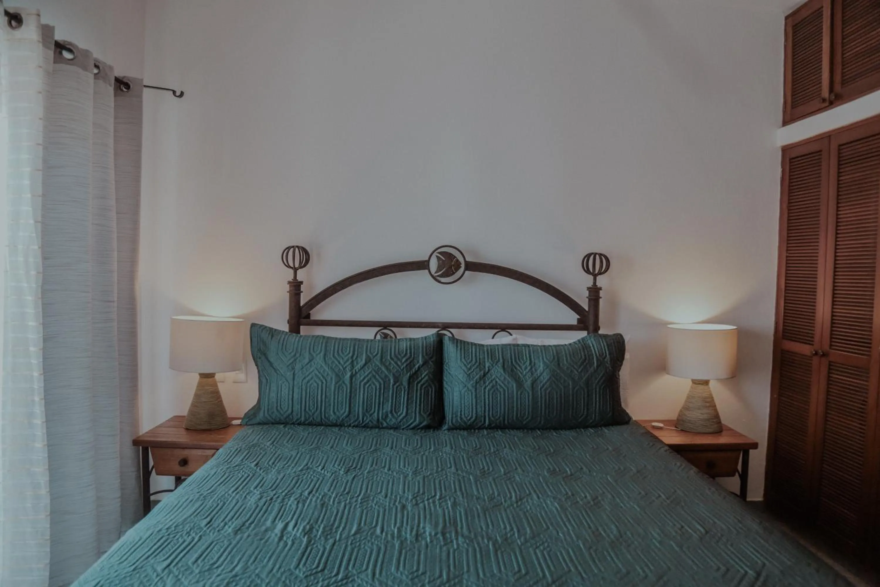 Bed in Fabiola Condo Hotel