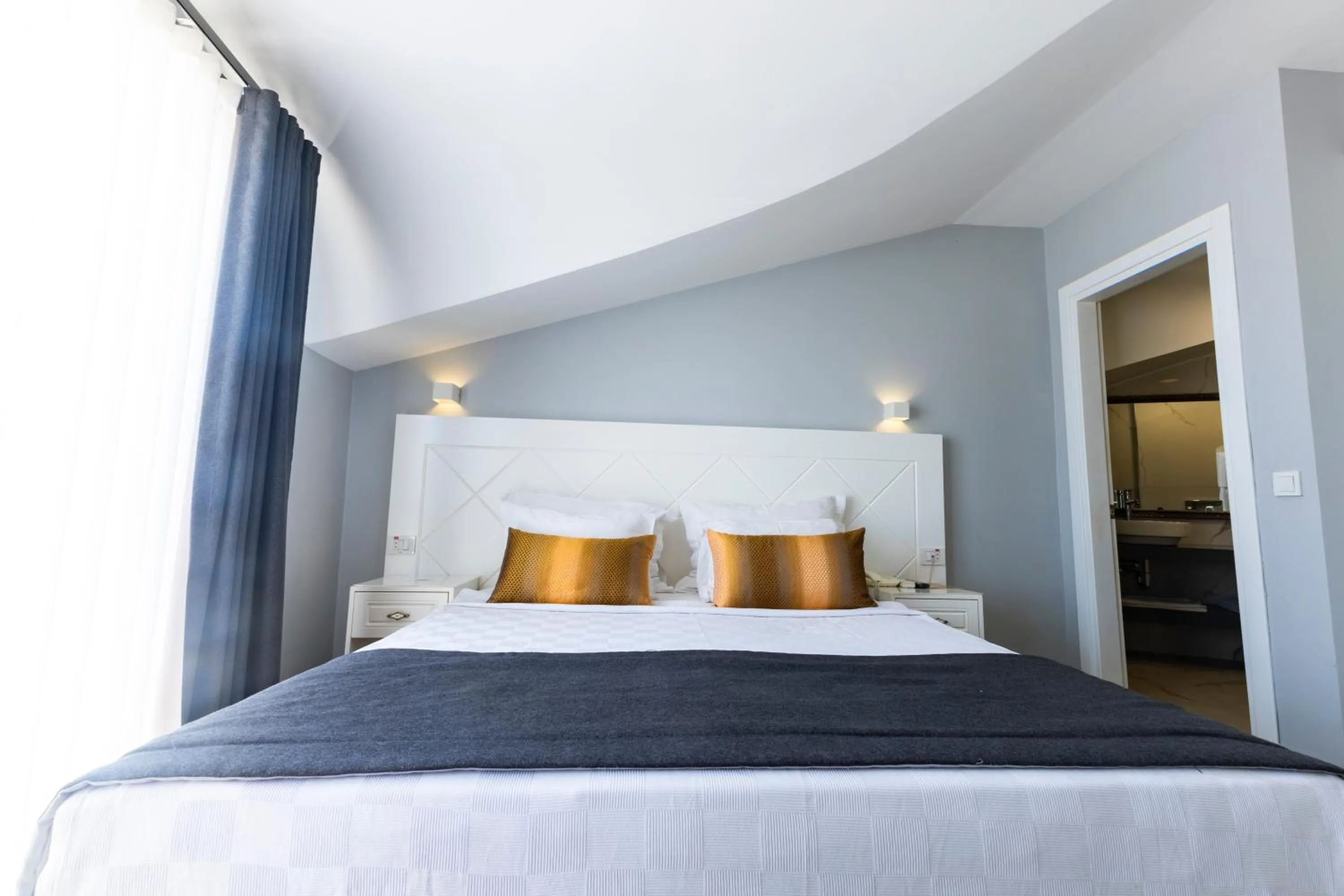 Bed in Motto Premium Hotel&Spa