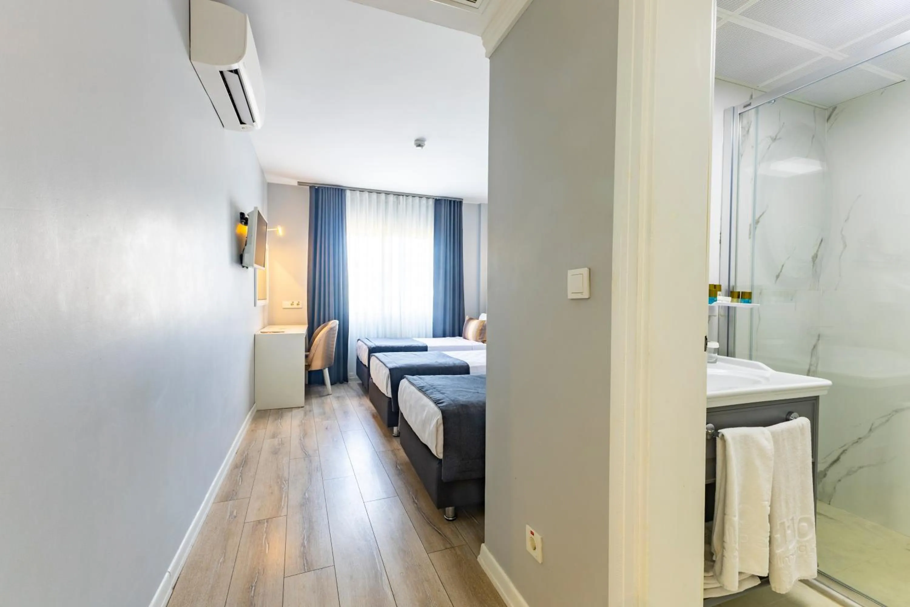 Bed in Motto Premium Hotel&Spa