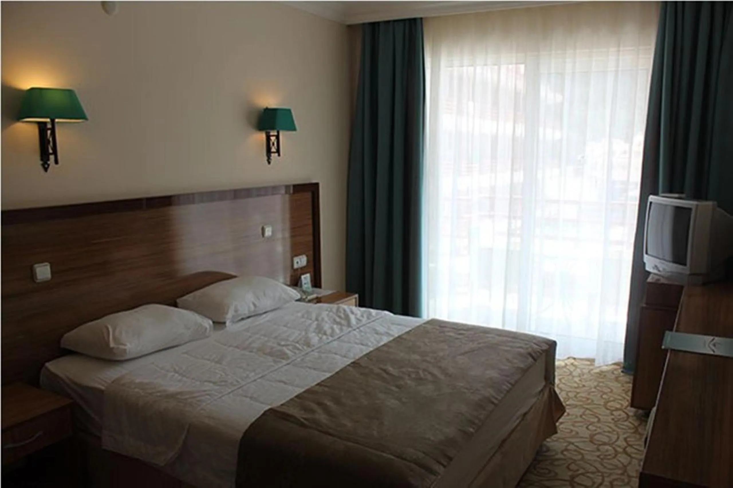 Bed in Green Nature Resort and Spa