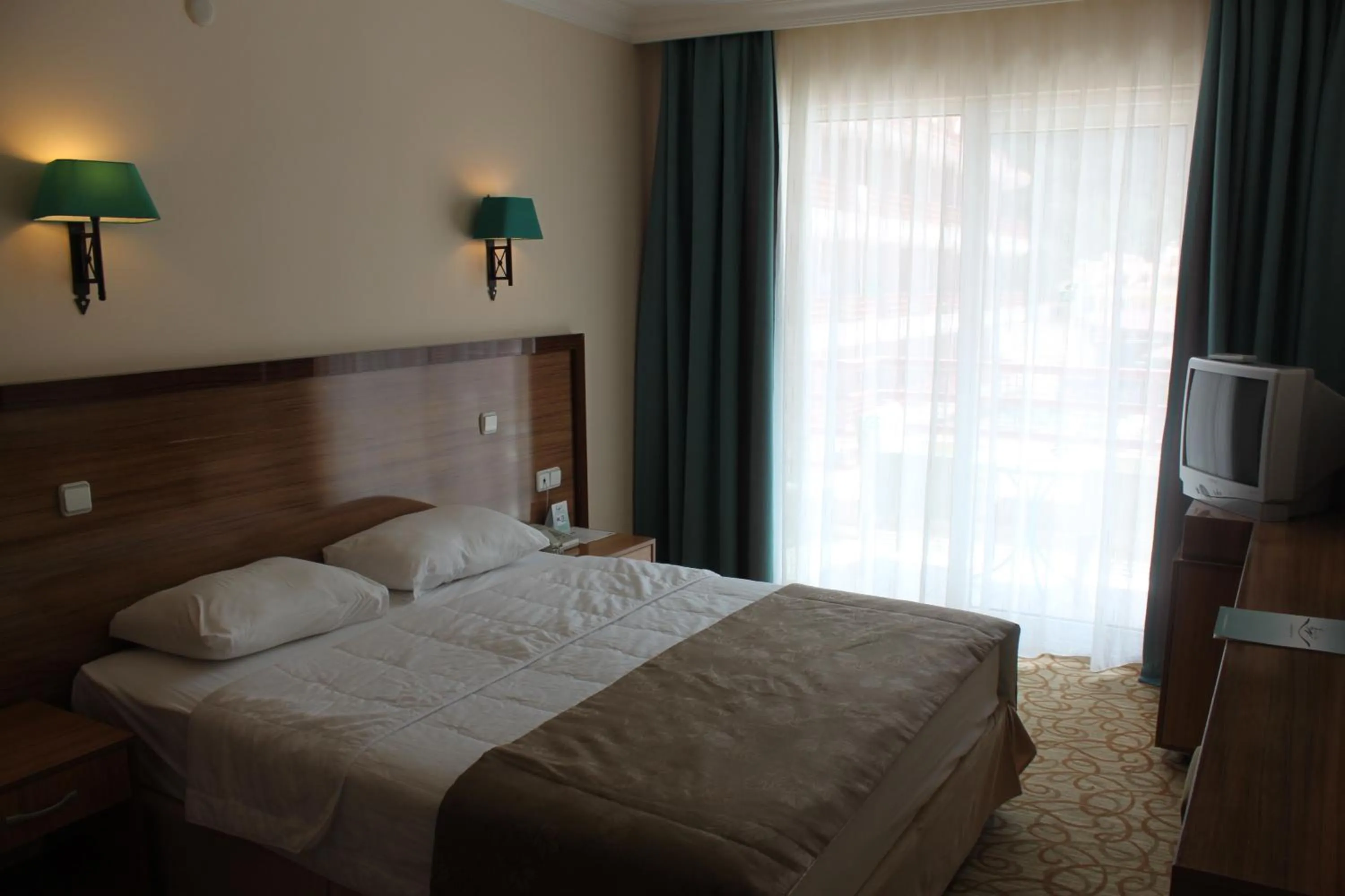 Bed in Green Nature Resort and Spa