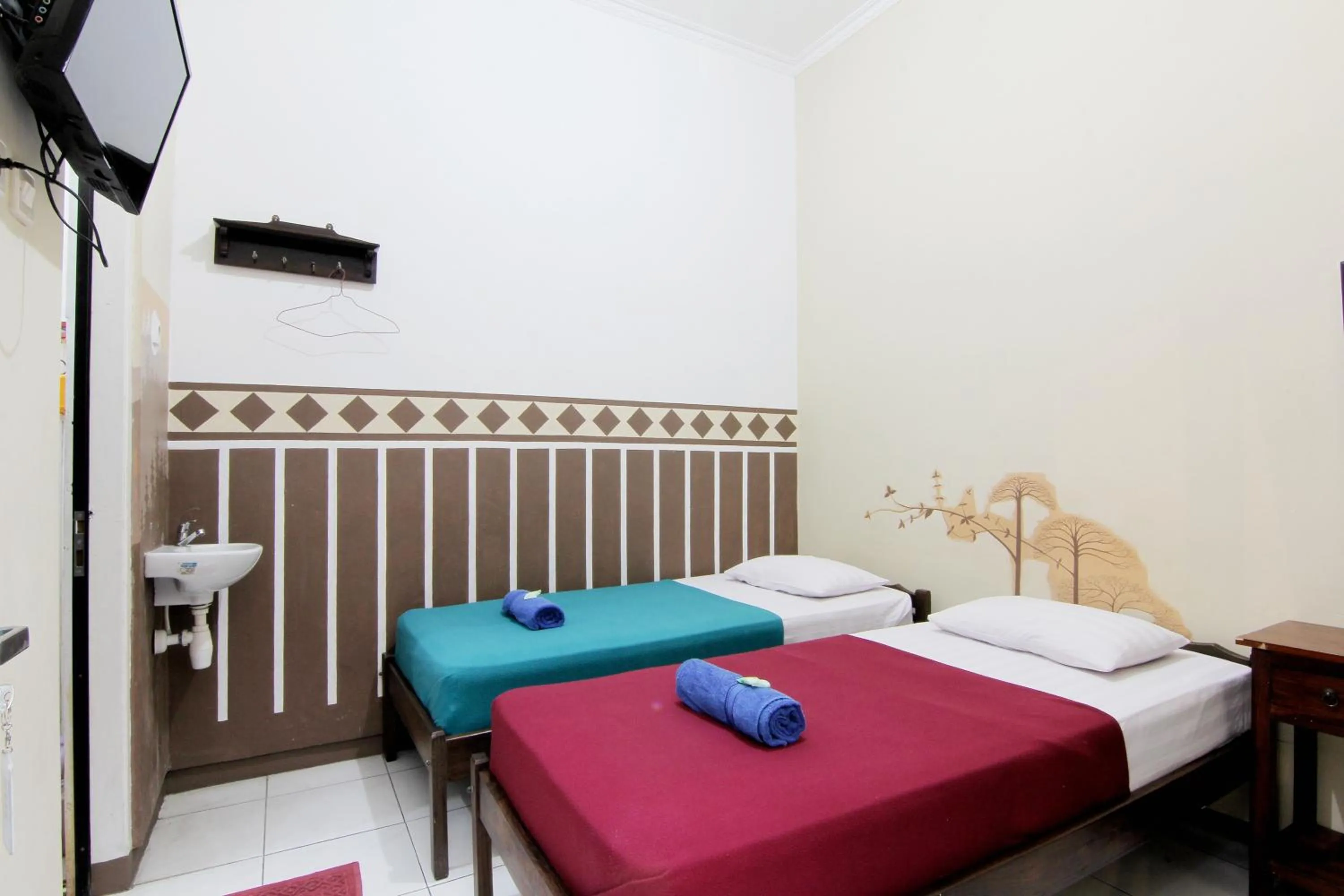 Bed in Monica Hotel Yogyakarta