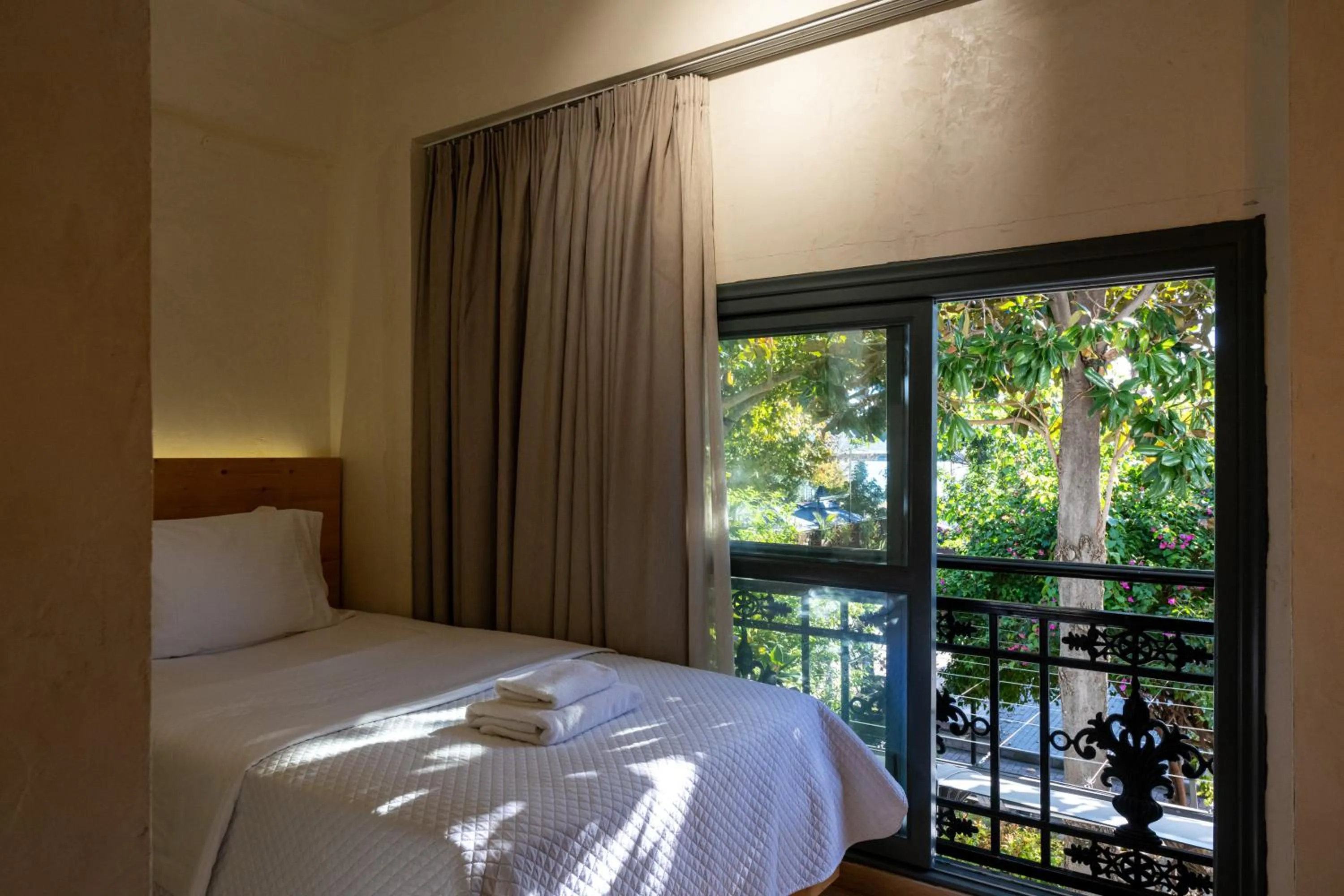 Bed in Panellinion Luxury Rooms