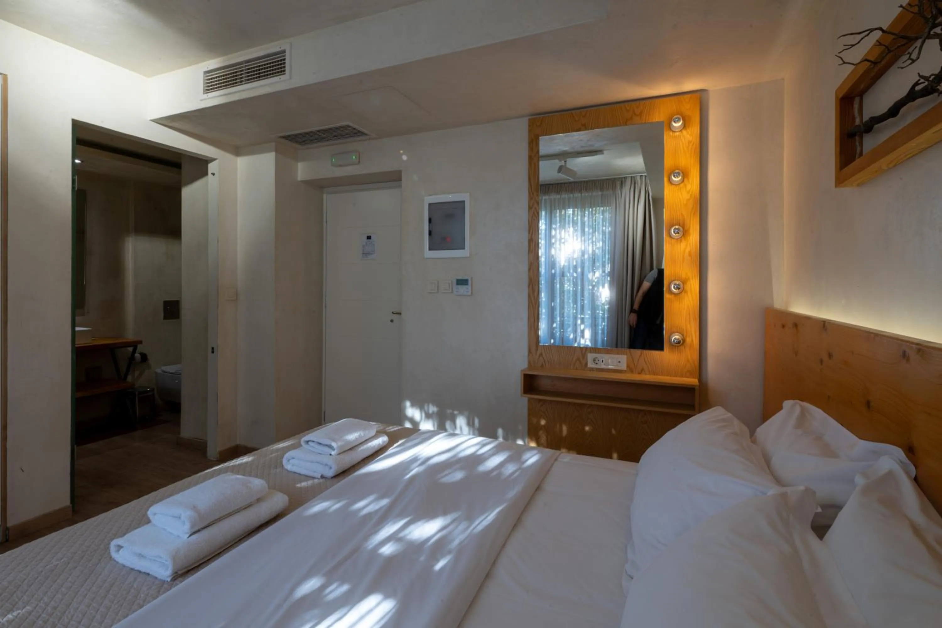 Bed in Panellinion Luxury Rooms