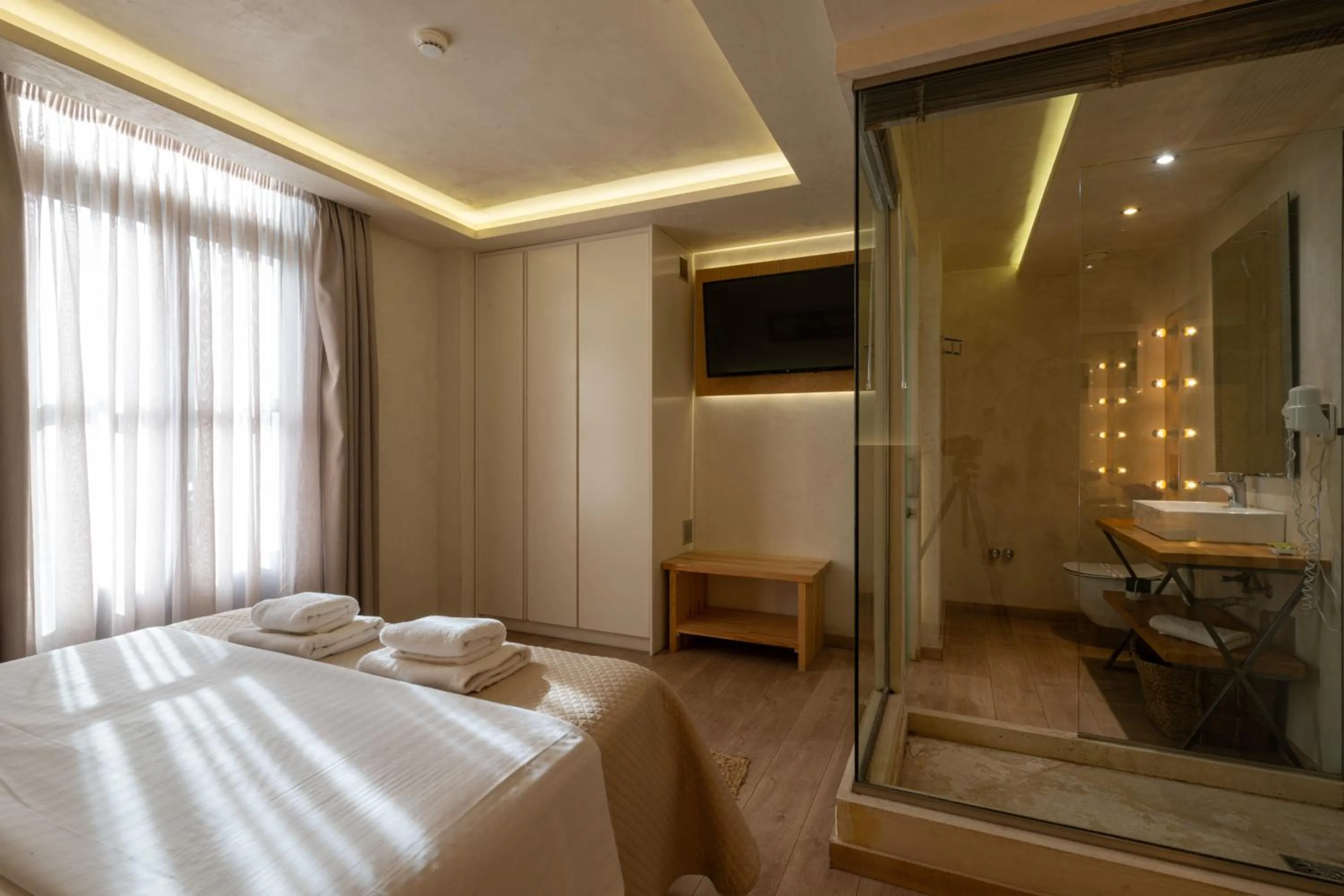 Photo of the whole room, Bed in Panellinion Luxury Rooms