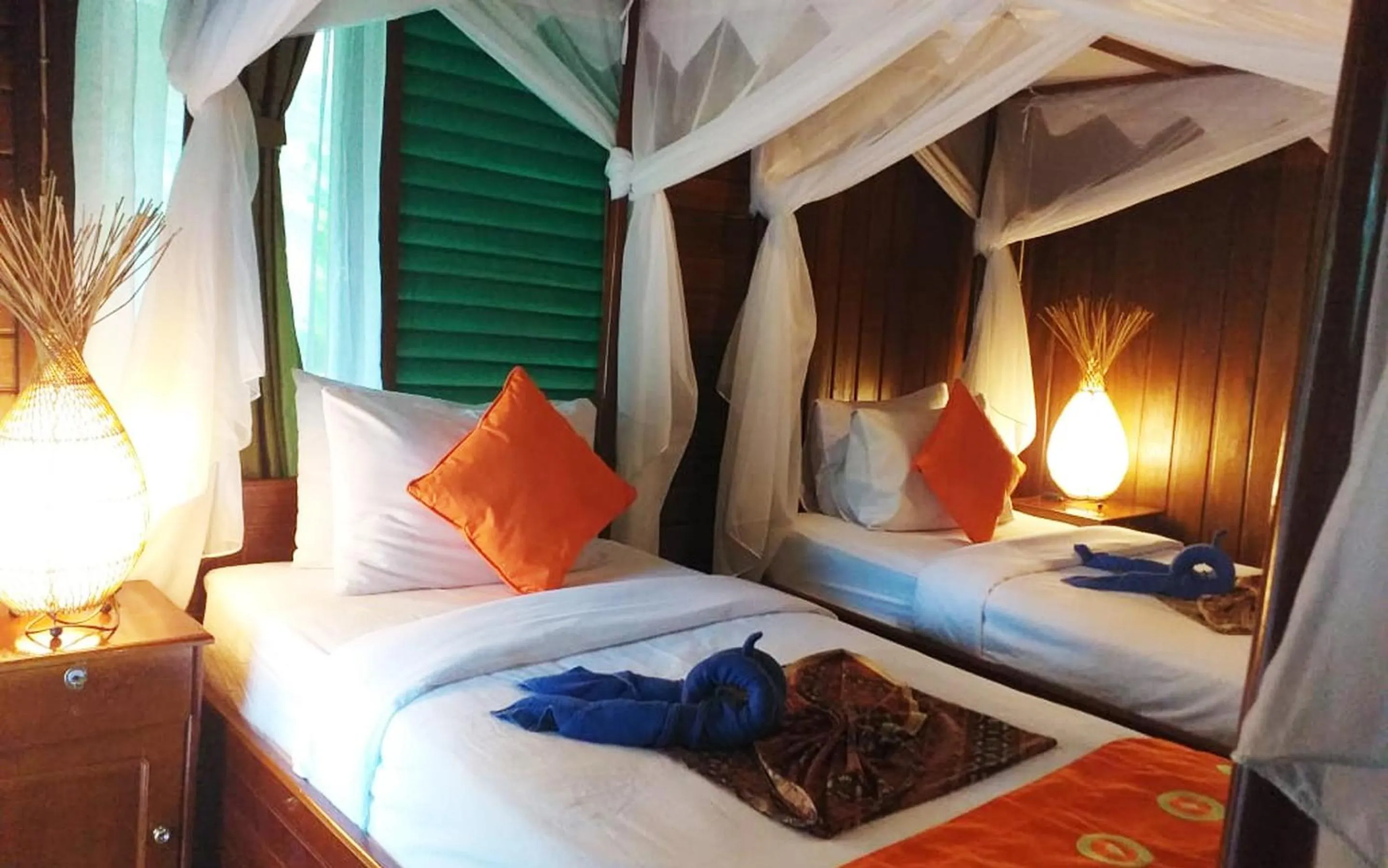 Bed in Bastianos Lembeh Dive Resort