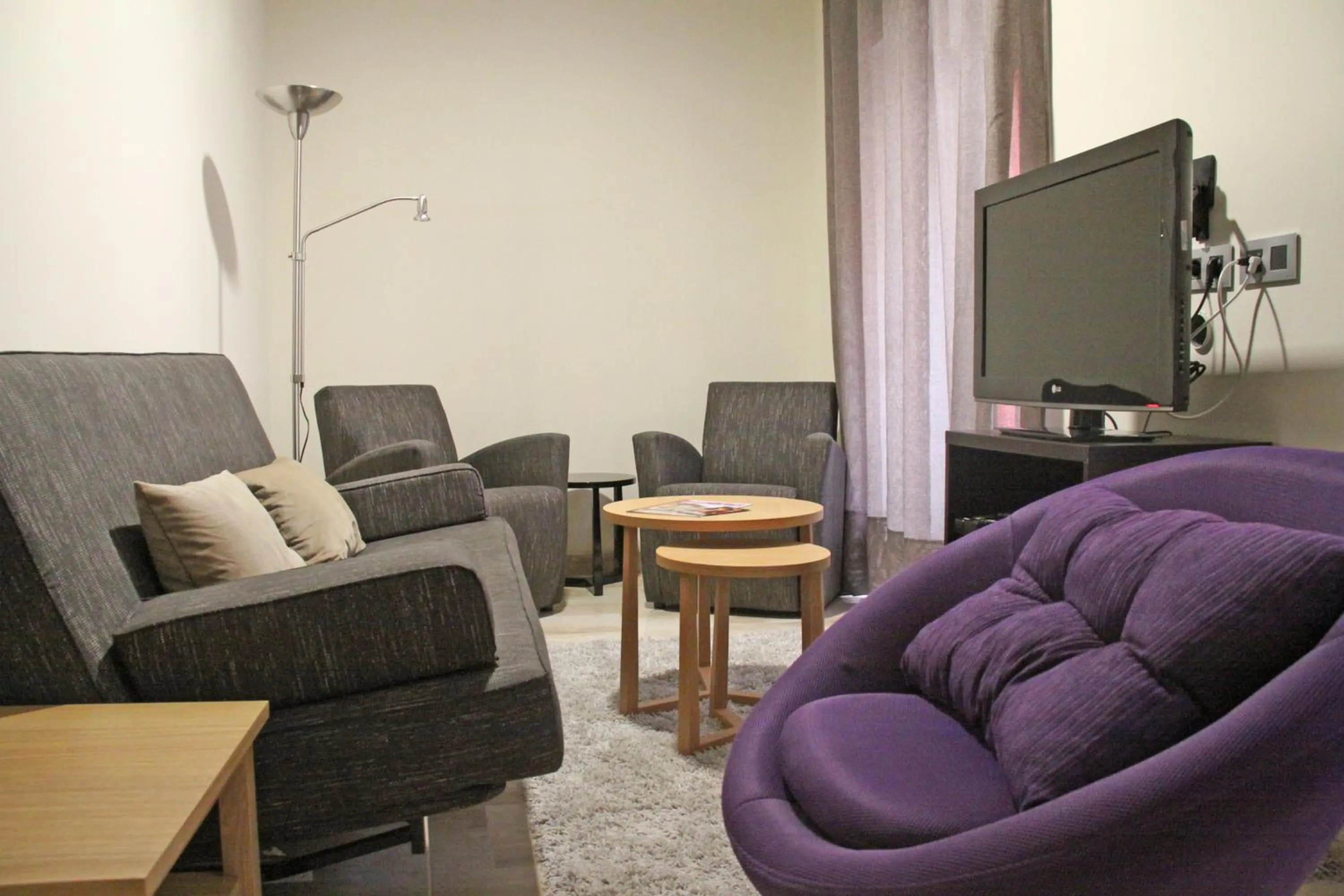 Living room in Apartamentos Living Sevilla Centro Maestranza