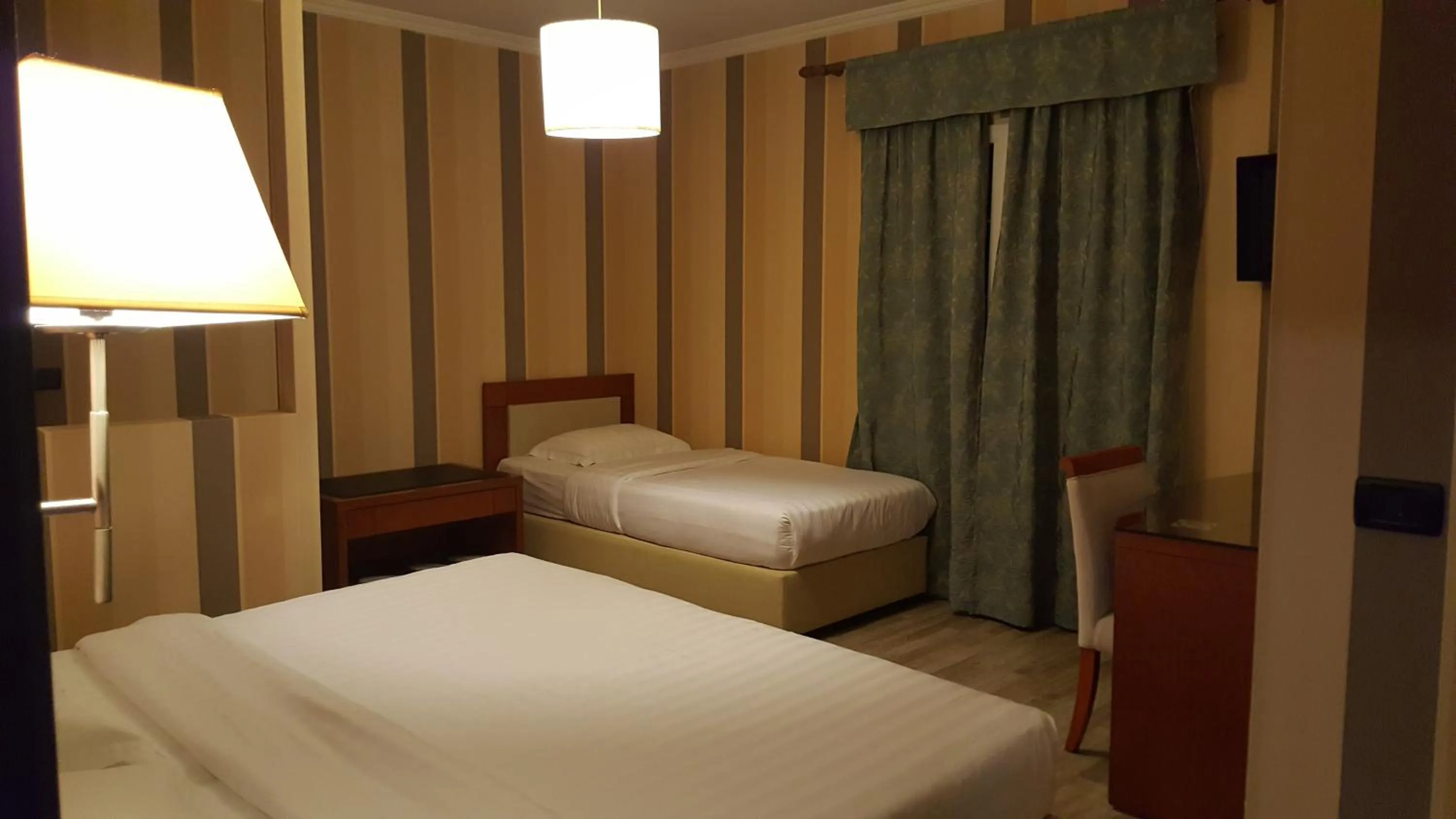 Bed in Bel Conti Hotel