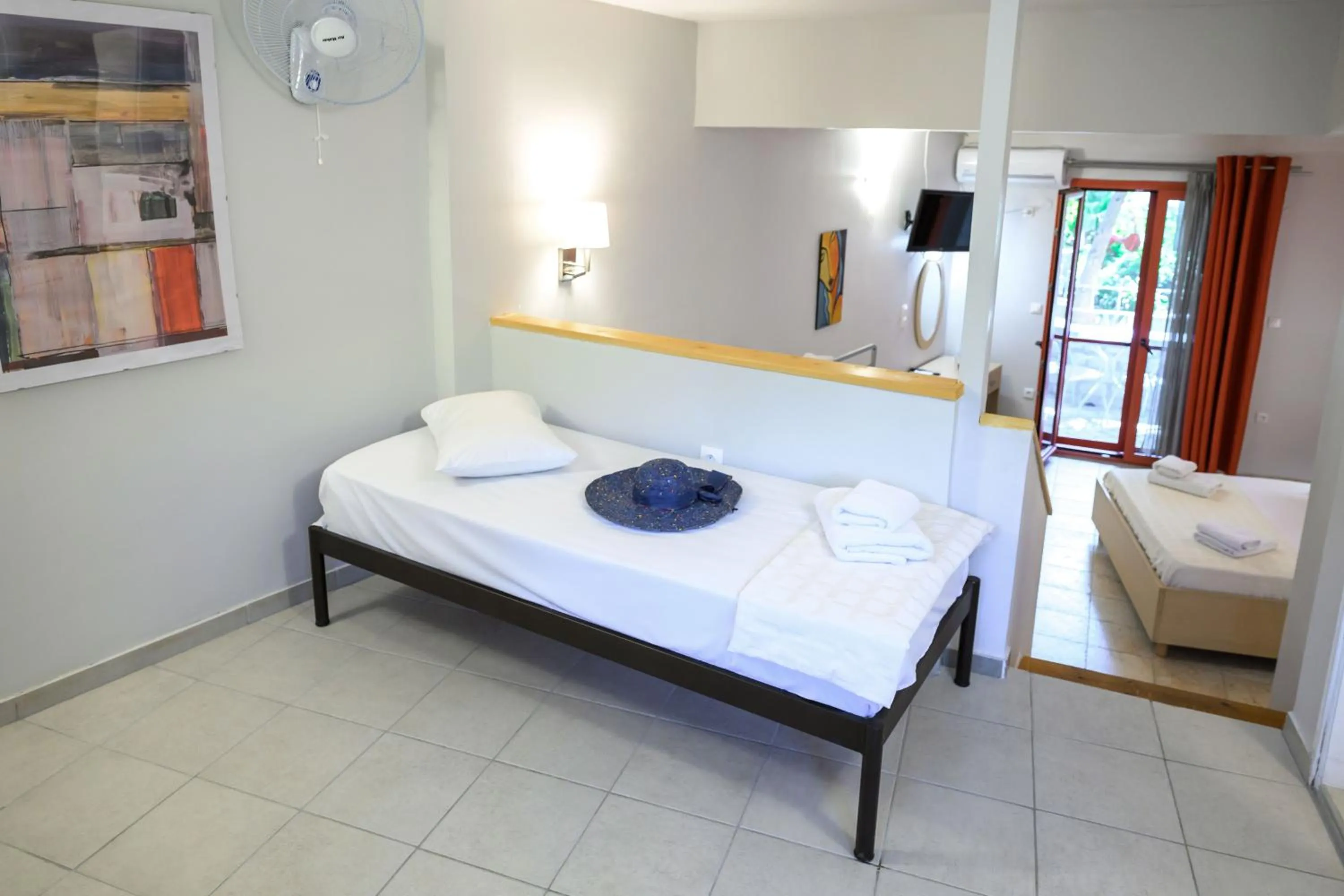 Bed in Rouda Bay Beach Hotel