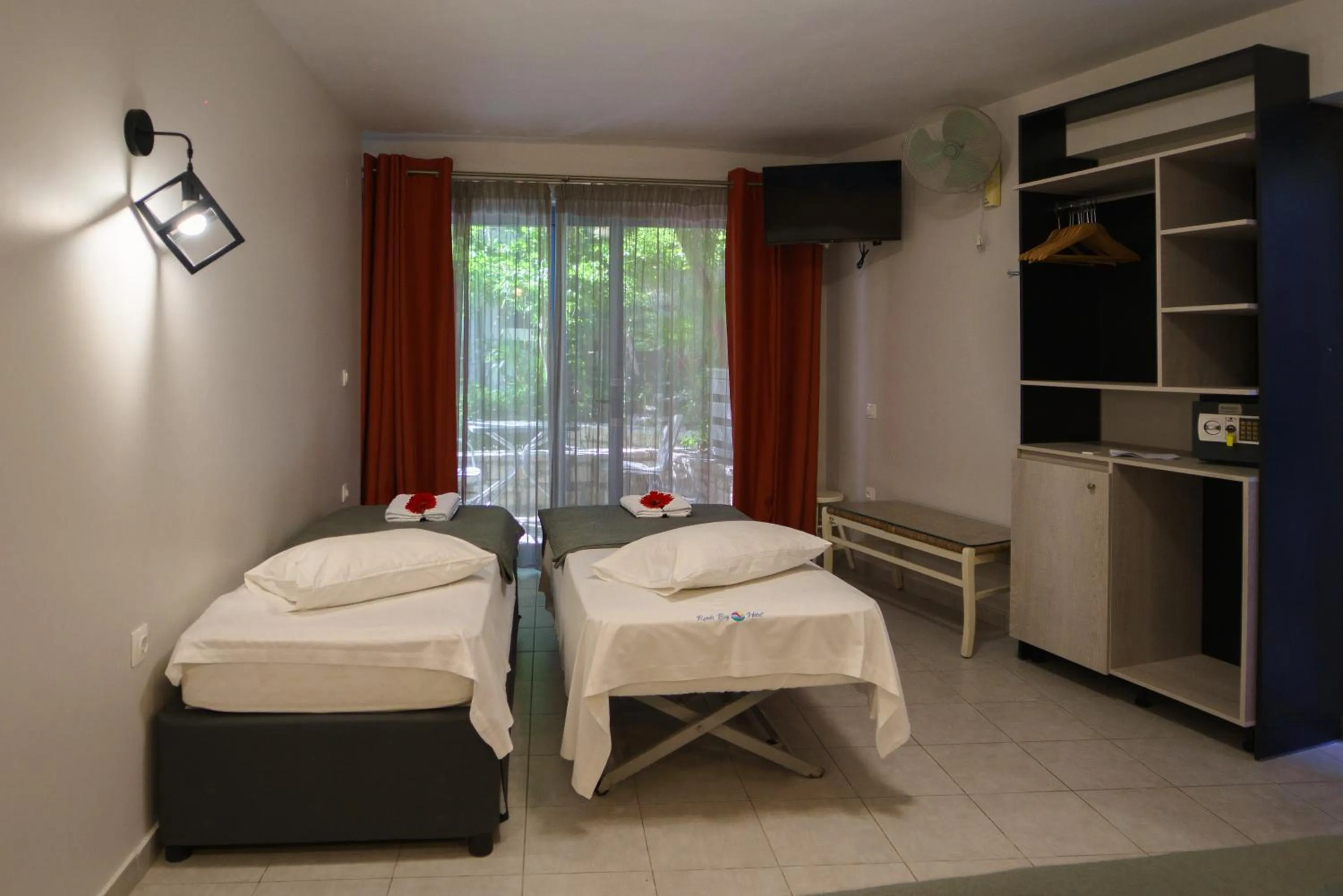 Bed in Rouda Bay Beach Hotel