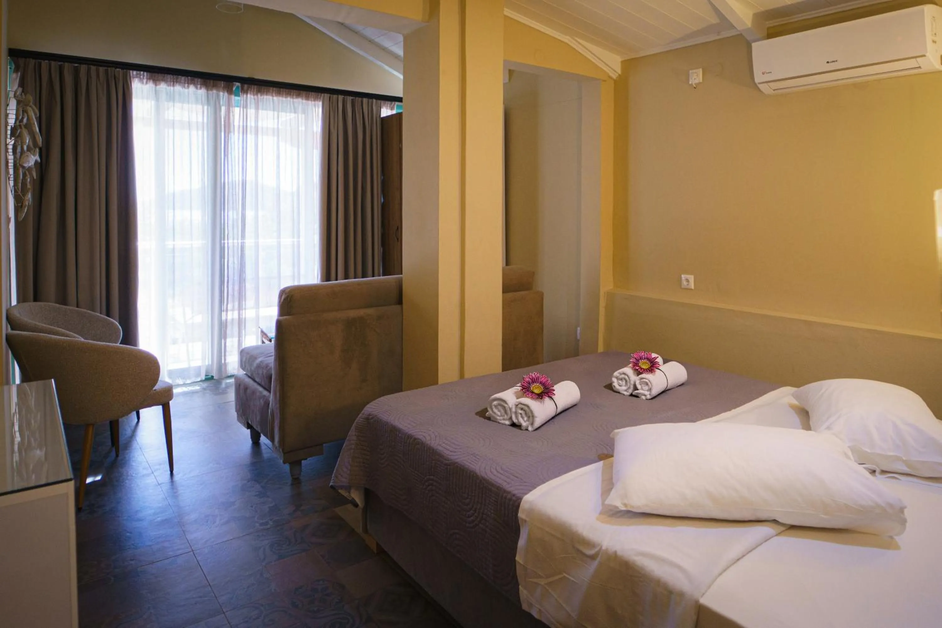 Bed in Rouda Bay Beach Hotel