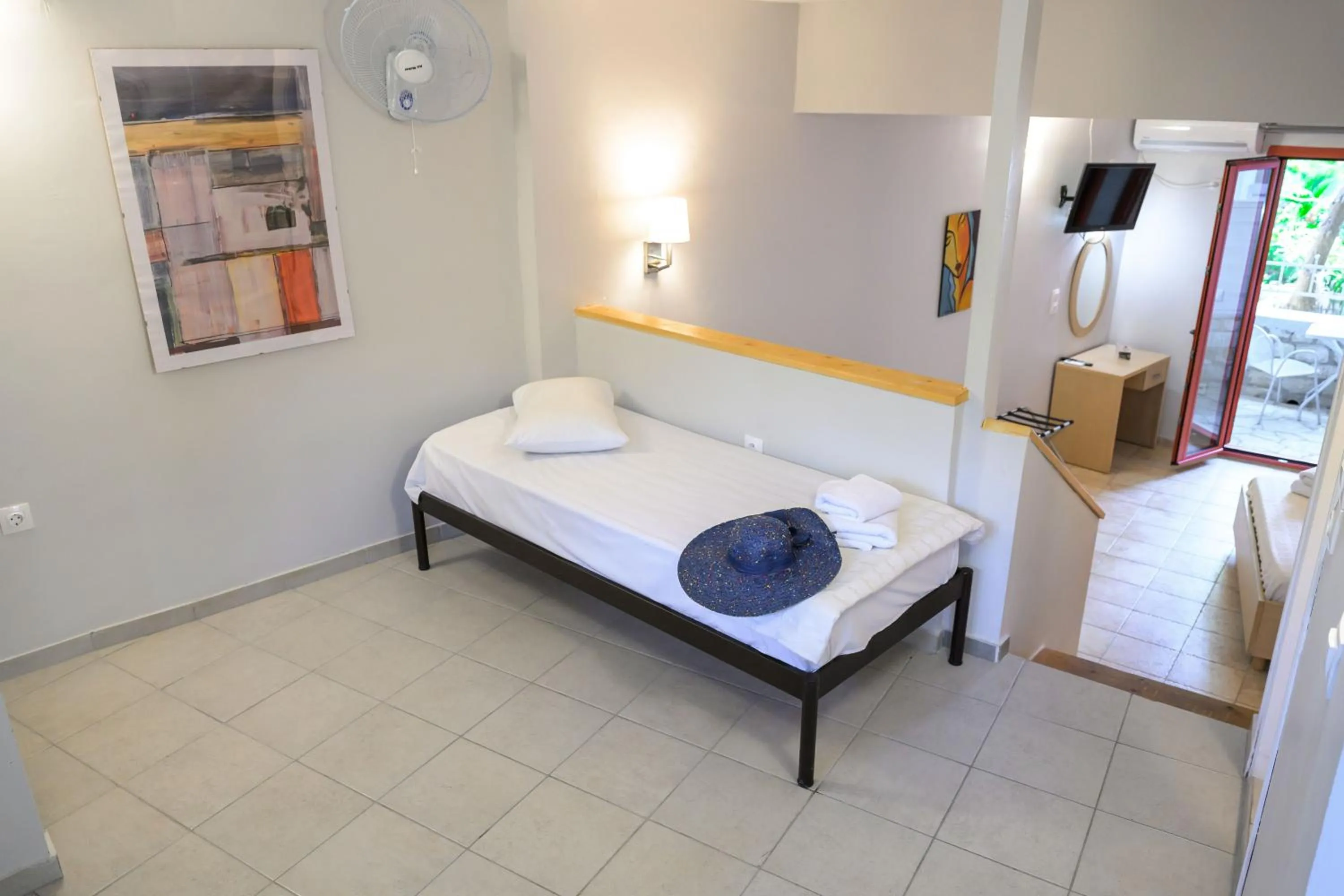 Bed in Rouda Bay Beach Hotel