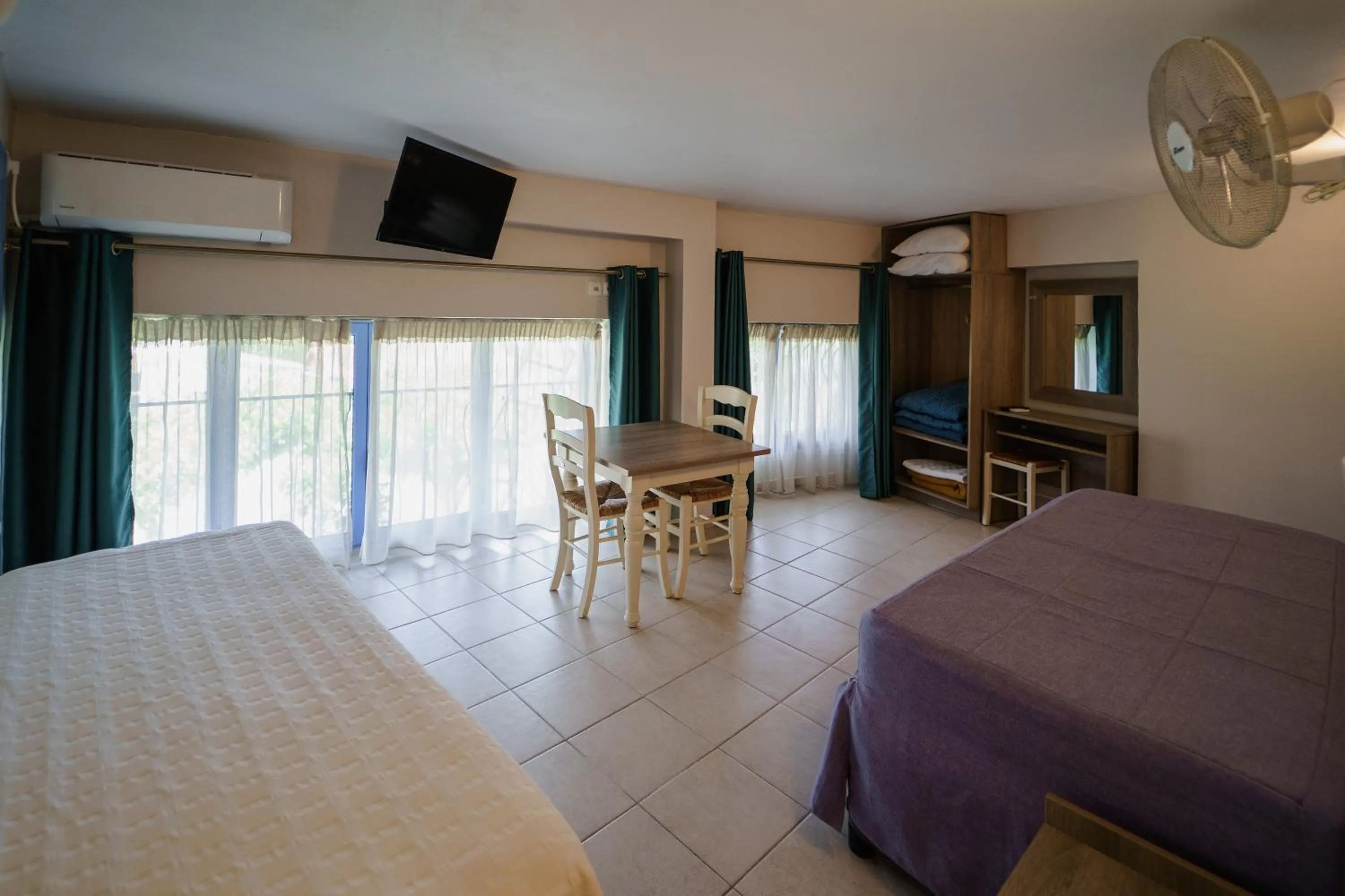 Bed in Rouda Bay Beach Hotel