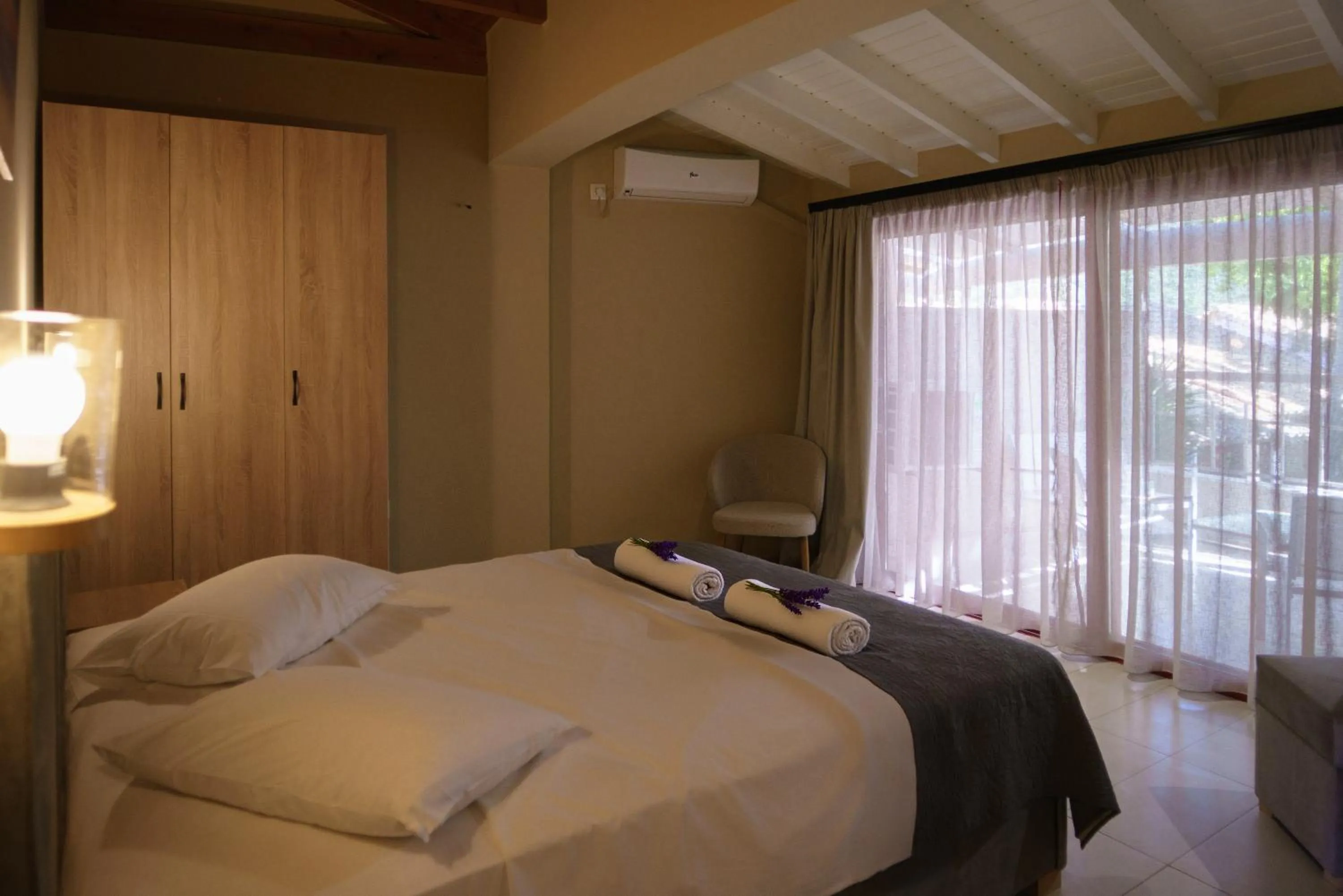 Bed in Rouda Bay Beach Hotel