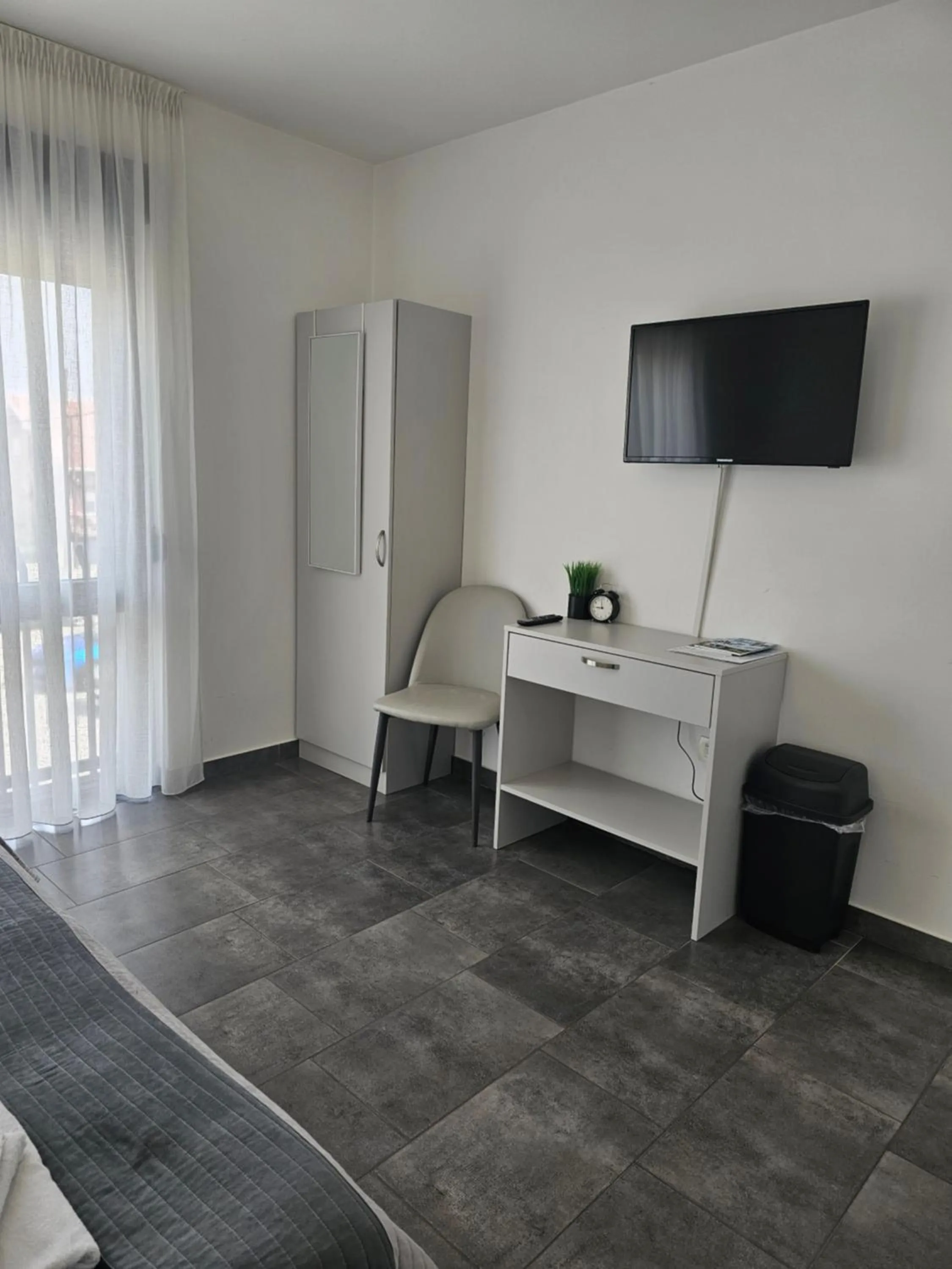 TV and multimedia, Bed in Filipovic rent a car & apartments