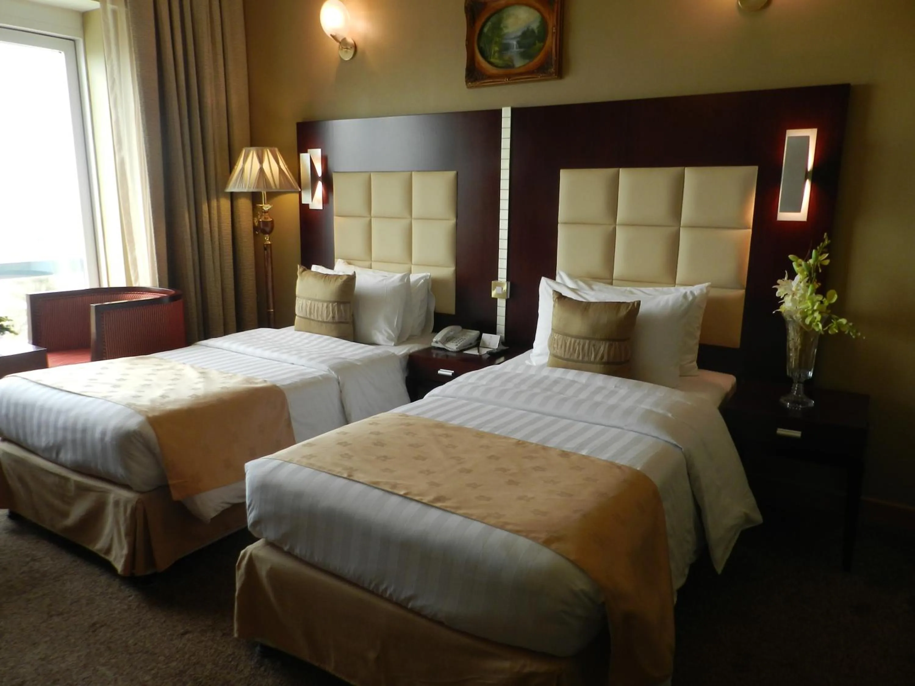 Bed in Sun & Sands Sea View Hotel