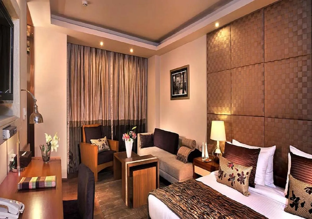 Bed in Udman Hotel Panchshila Park