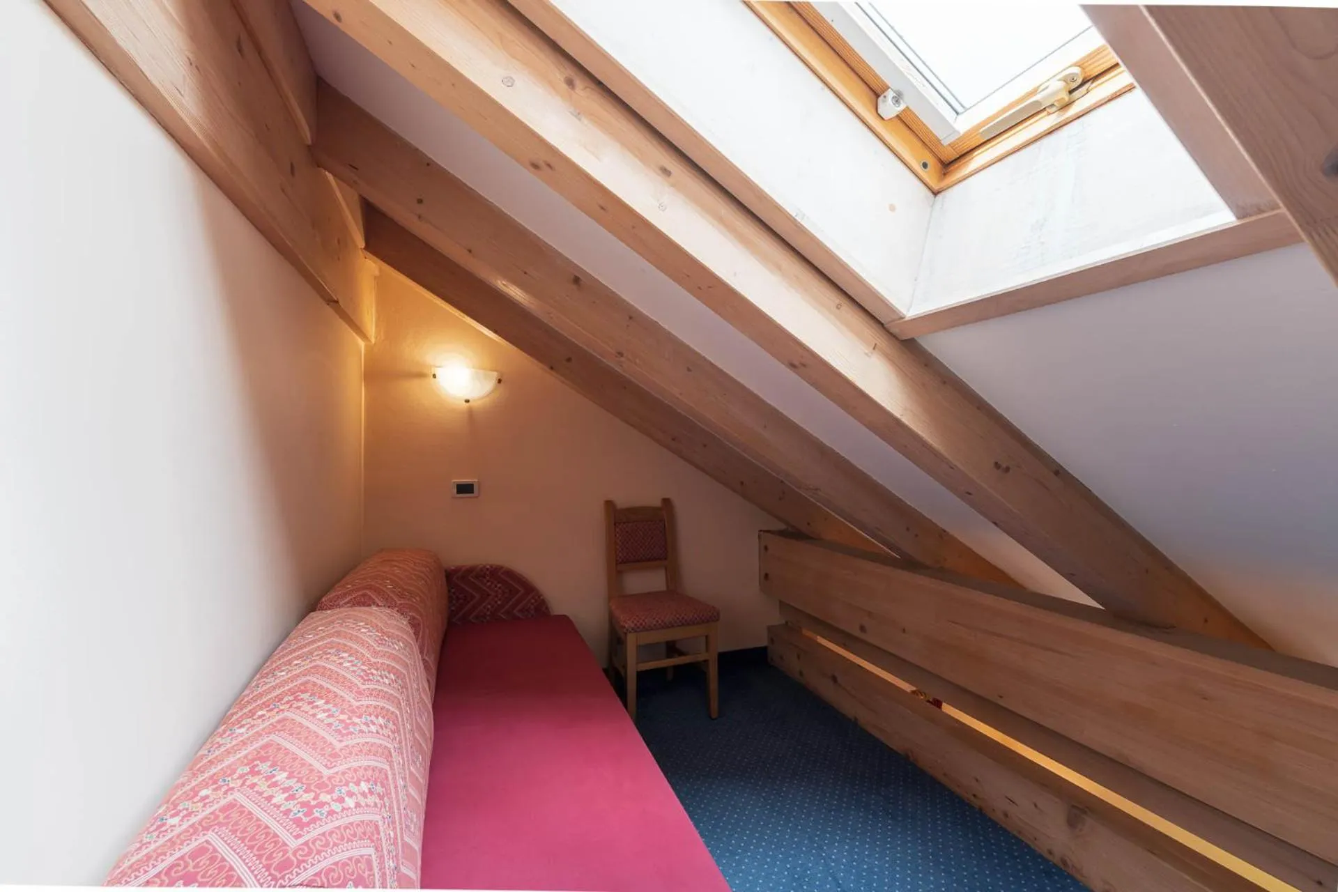 Seating area, Bed in Albergo Conturina