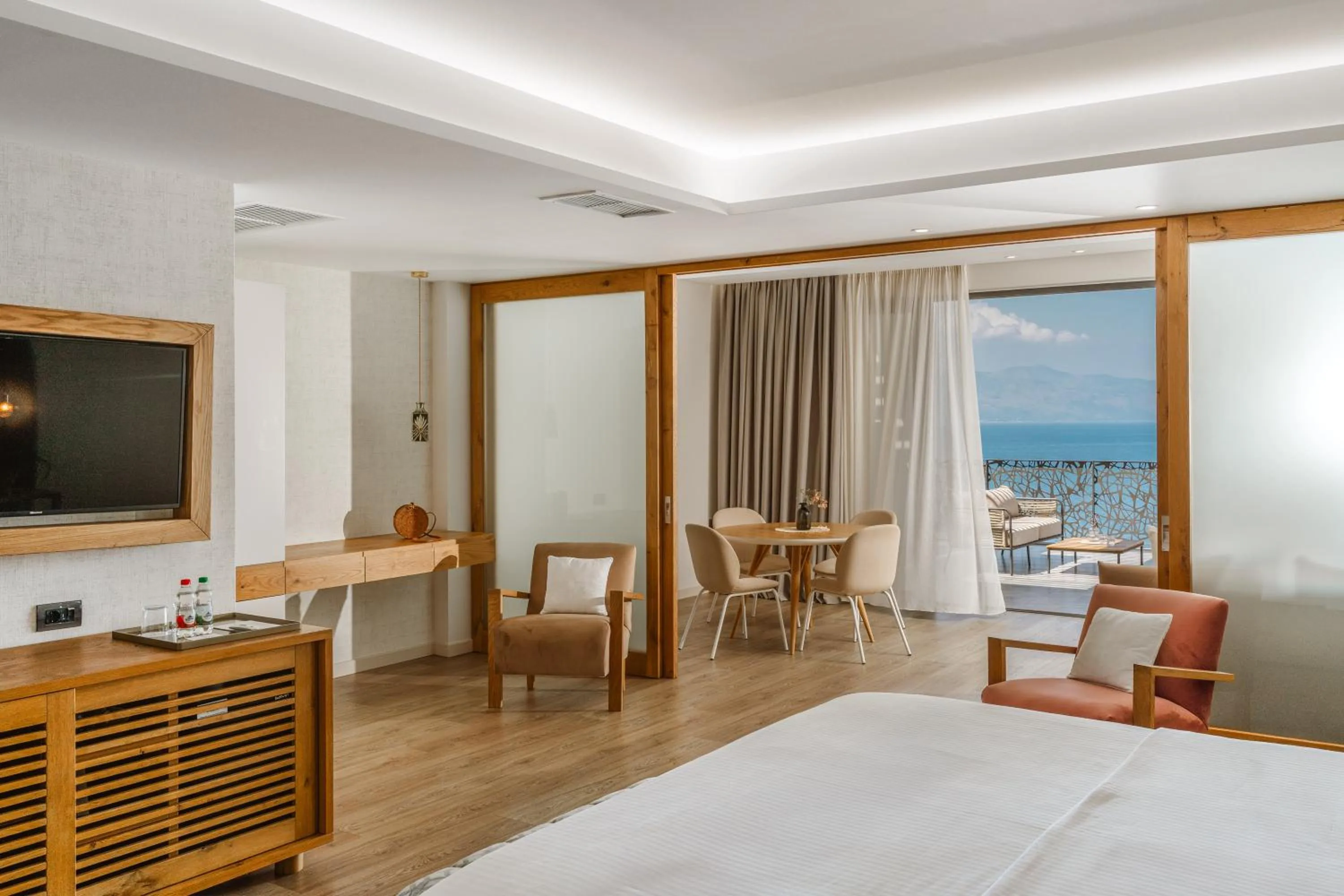 Seating area, Bed in Glow Boutique Hotel & Suites