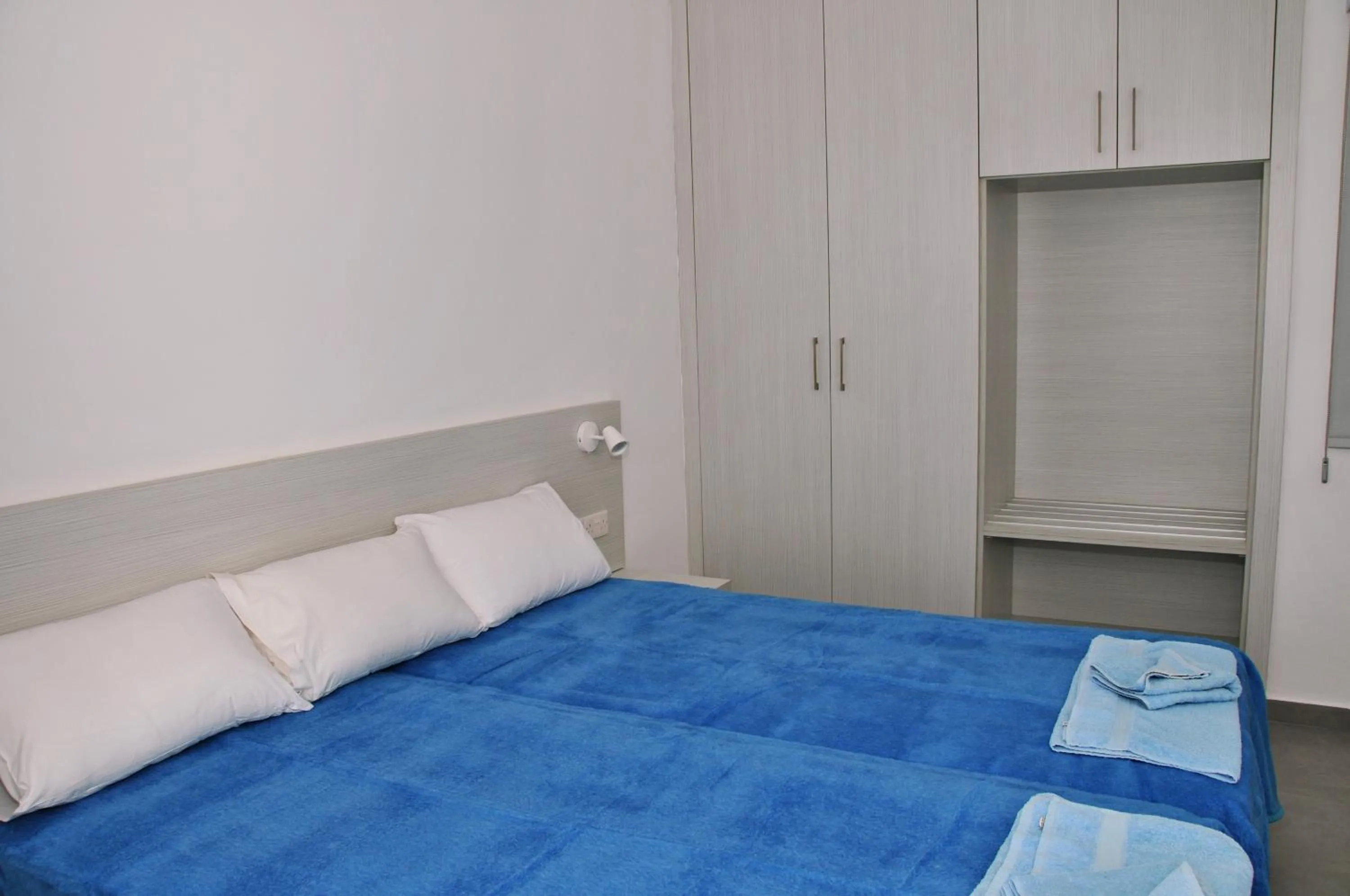 Bed in Kaos Hotel Apartments