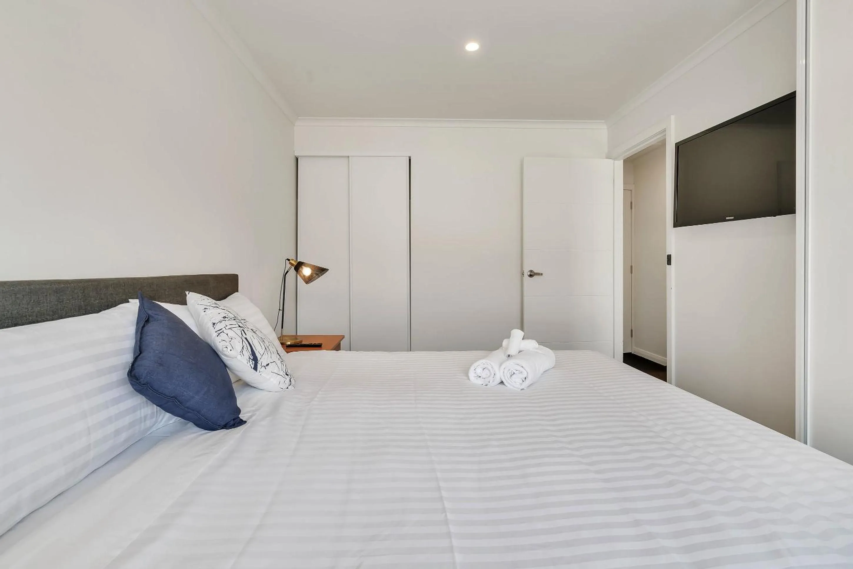 TV and multimedia, Bed in Youngtown Executive Apartments - 2BR included, Free Parking & Wifi, Sofa Bed & Cot fee applies