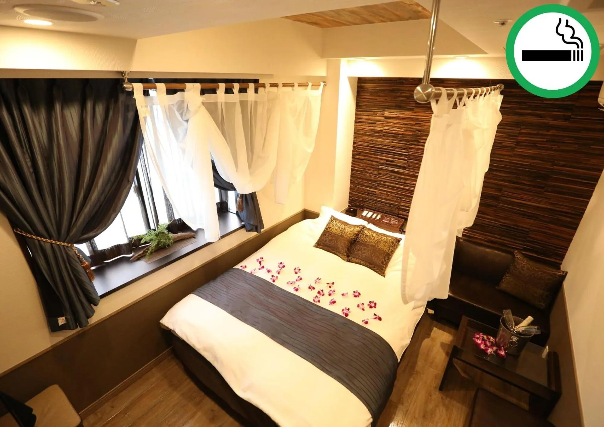 Bed in HOTEL PetitBali Higashi-Shinjuku