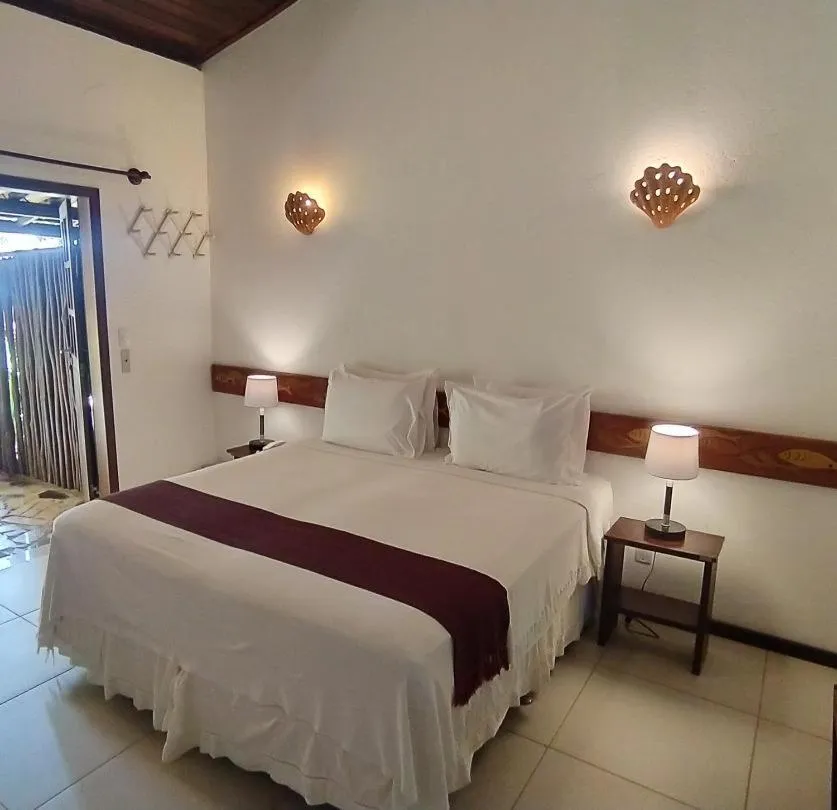 Bed in Pousada Jambo