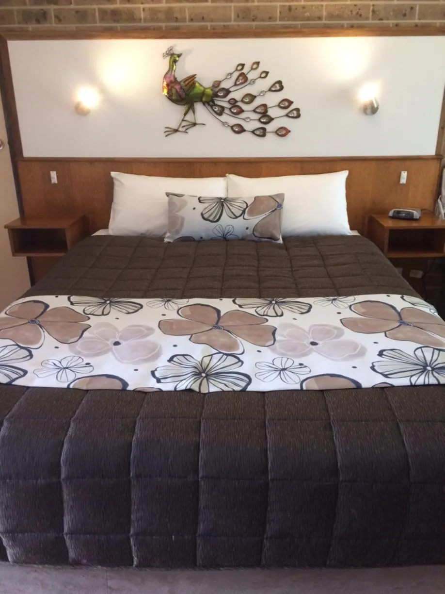 Bed in Idlewilde Town & Country Motor Inn