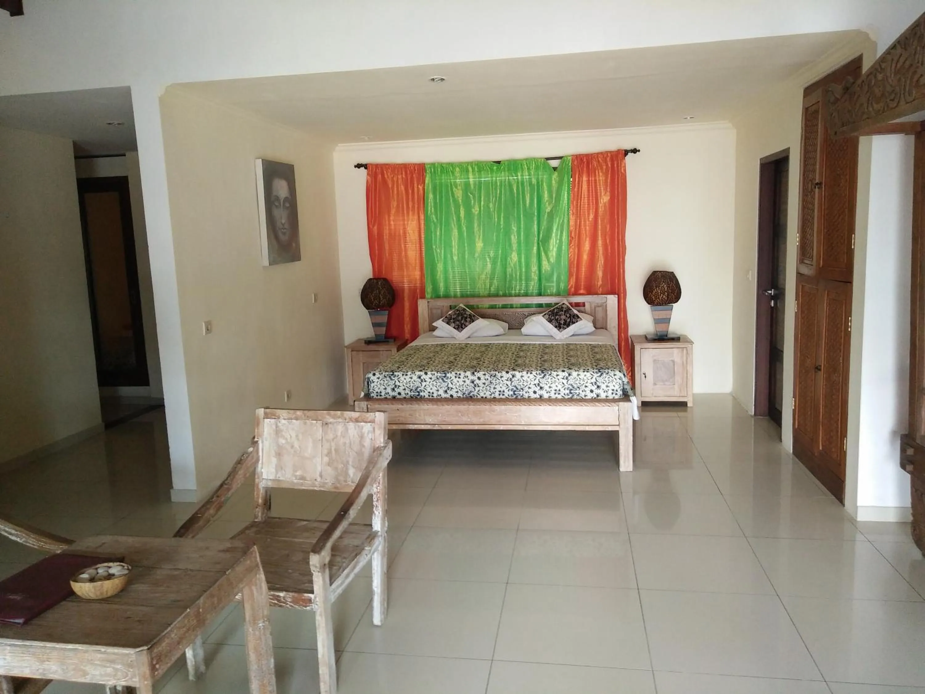 Bed in Frangipani Beach Hotel