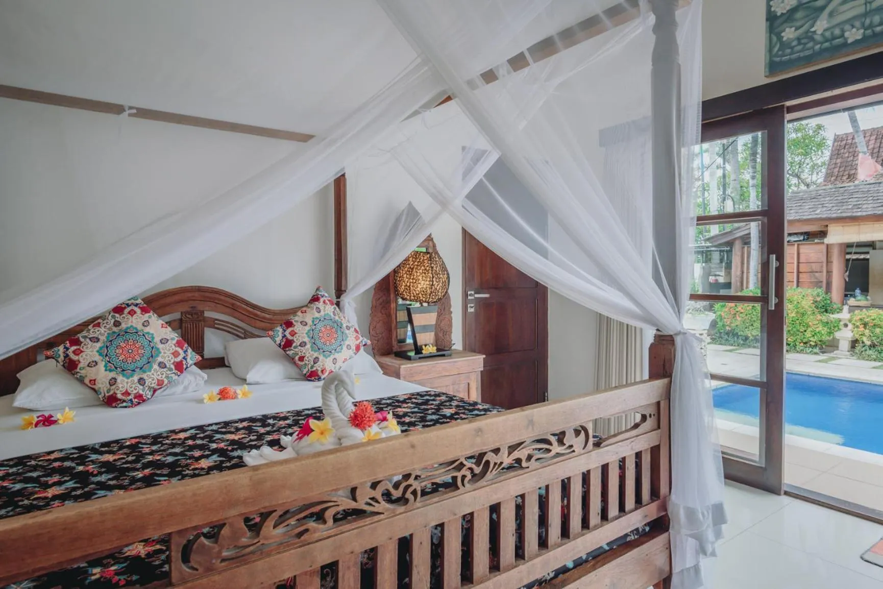 Bed in Frangipani Beach Hotel