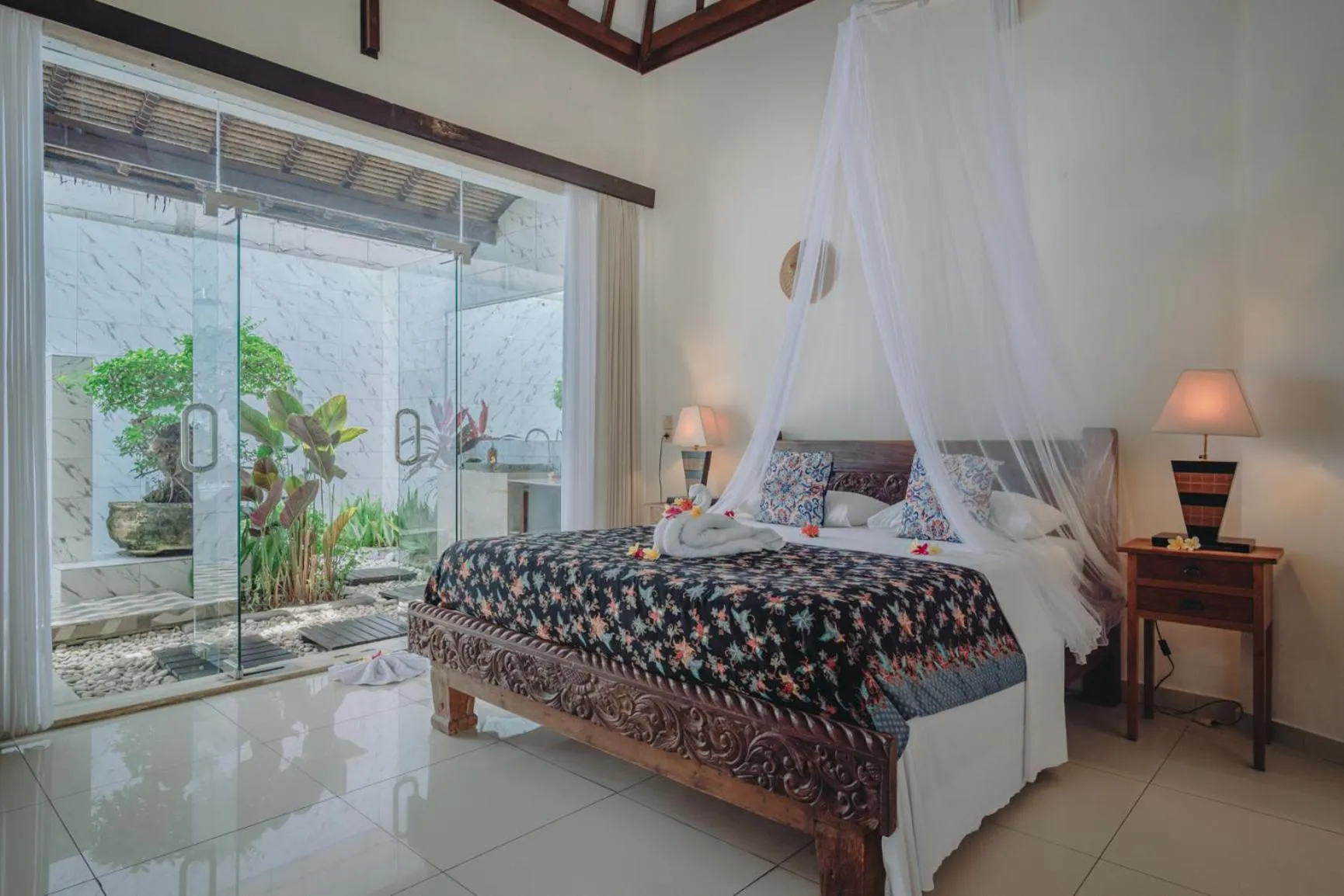 Bed in Frangipani Beach Hotel