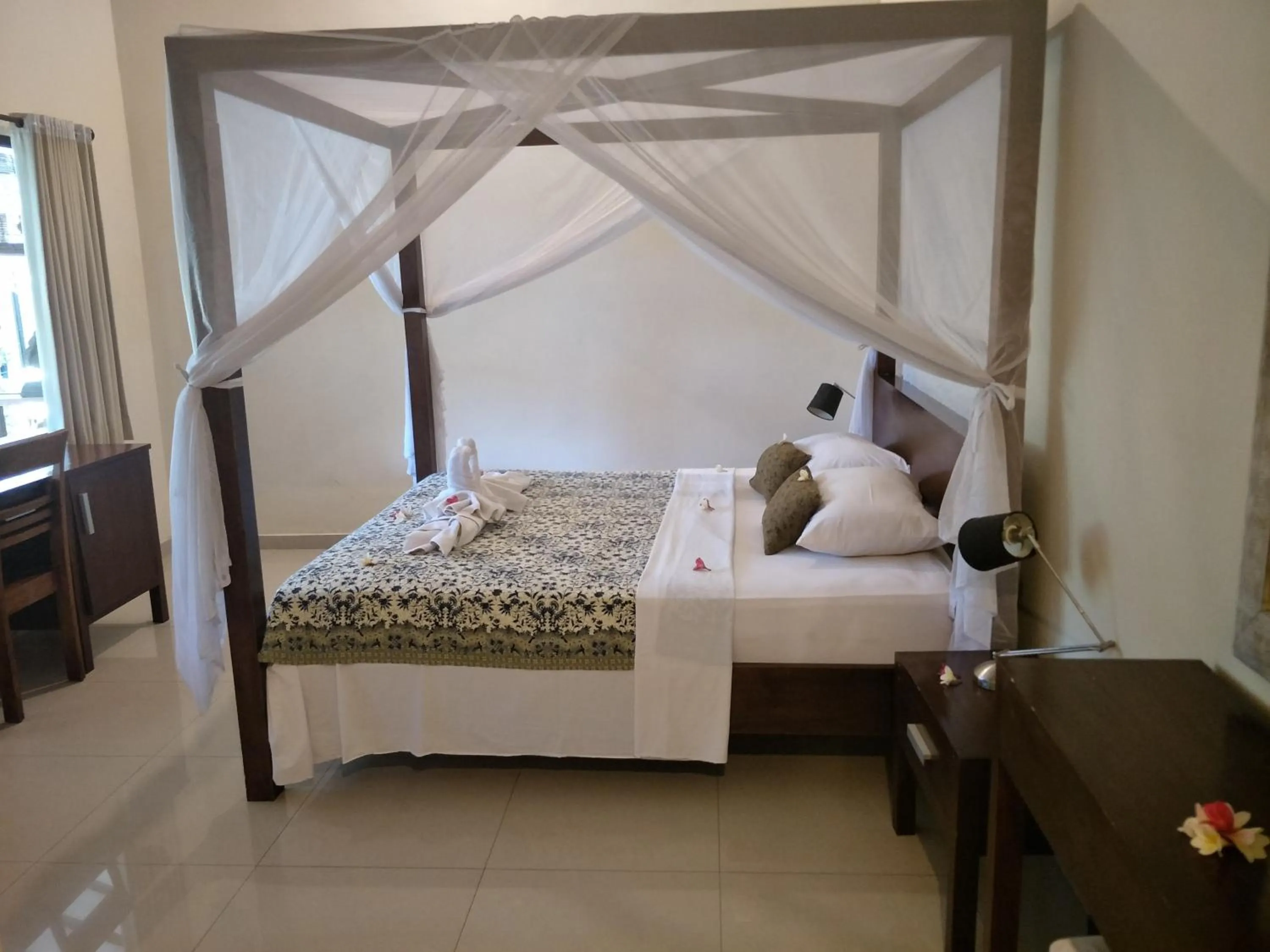 Bed in Frangipani Beach Hotel
