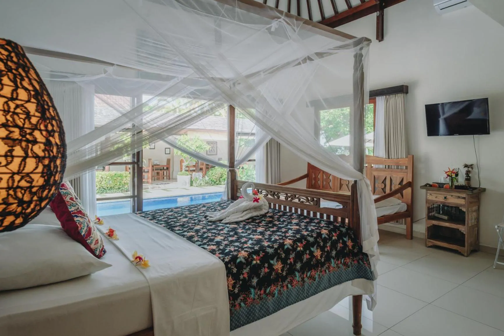 Bed in Frangipani Beach Hotel