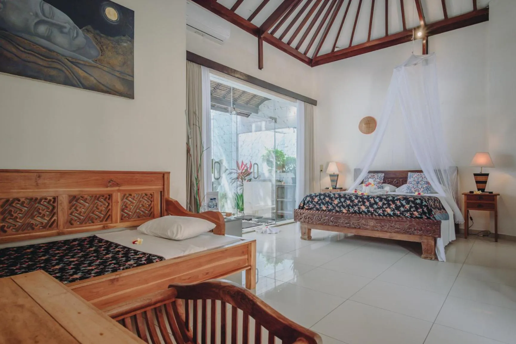 Bed in Frangipani Beach Hotel