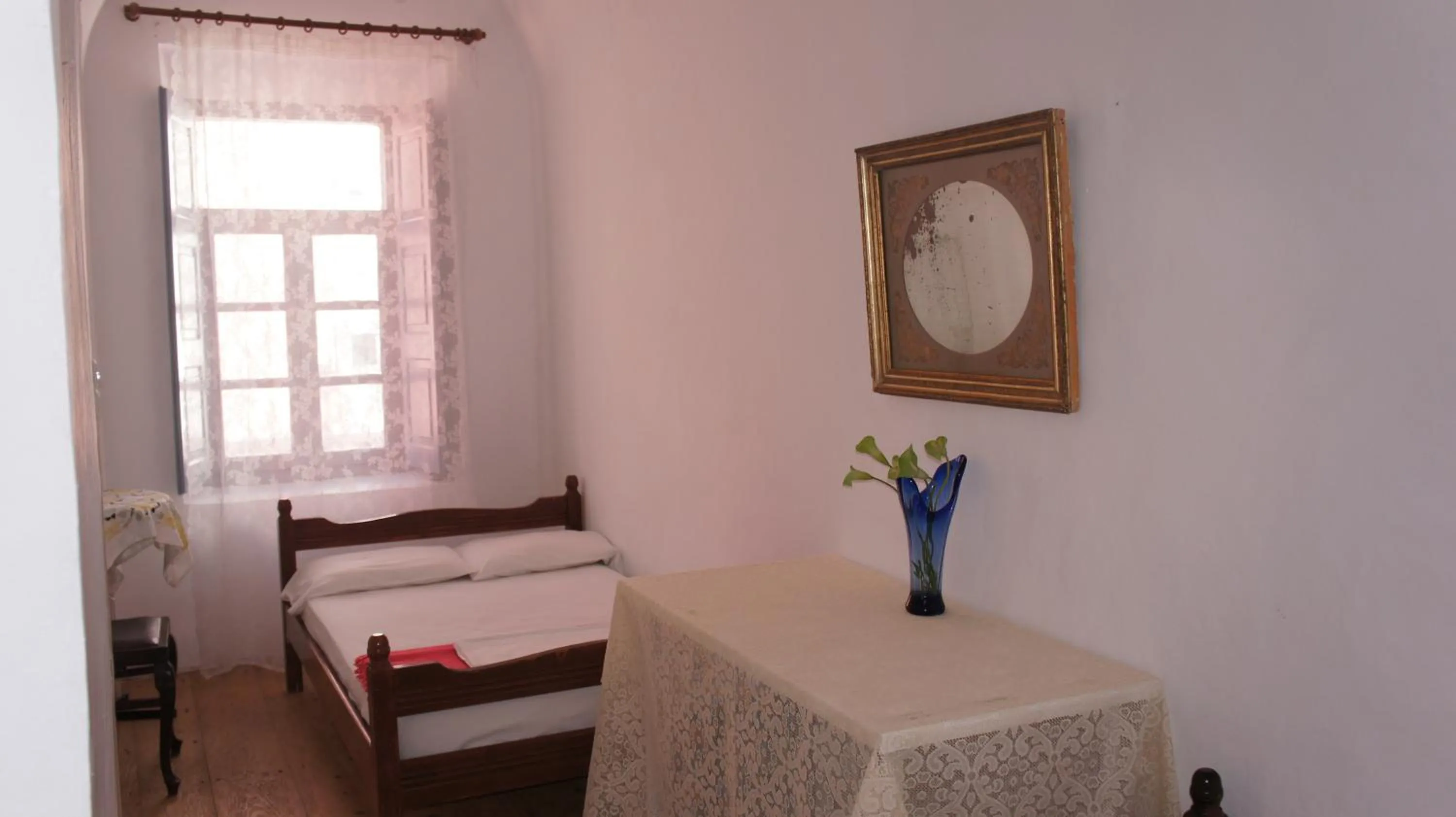 Photo of the whole room, Bed in Marcos Rooms