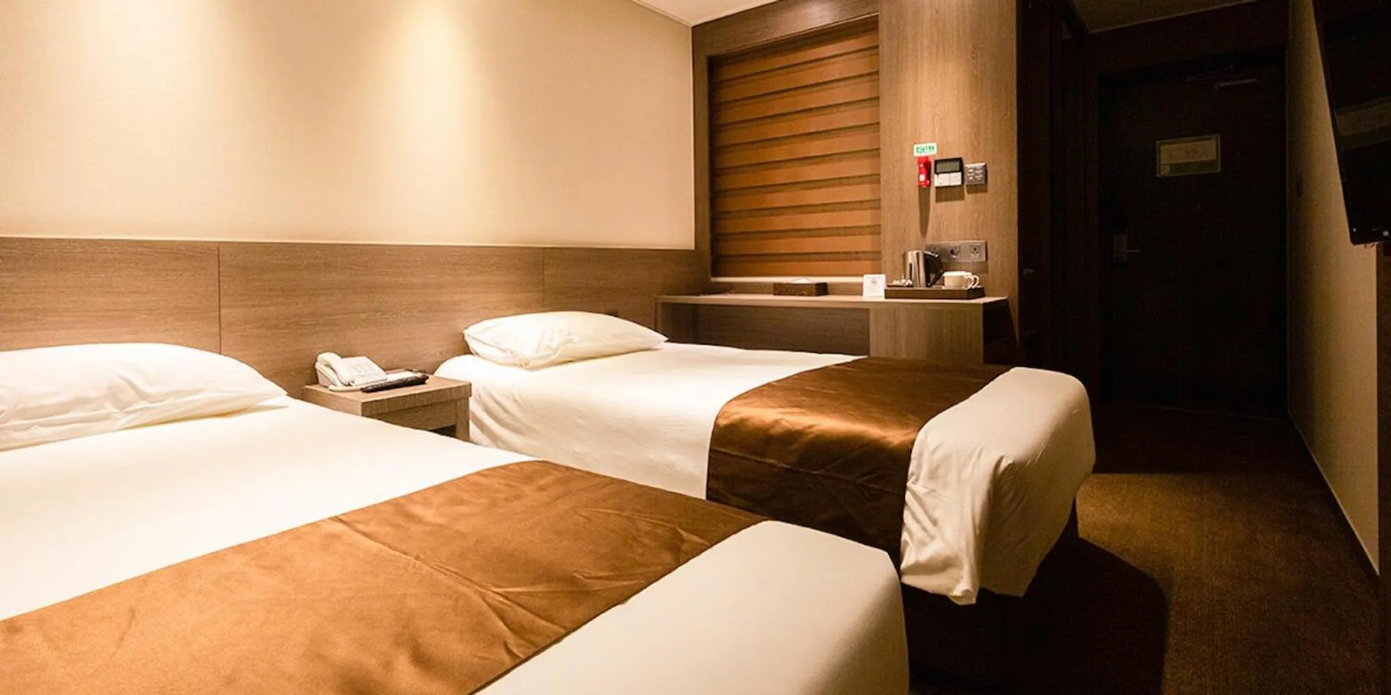 Bed in Grandmillions Hotel Seogwipo