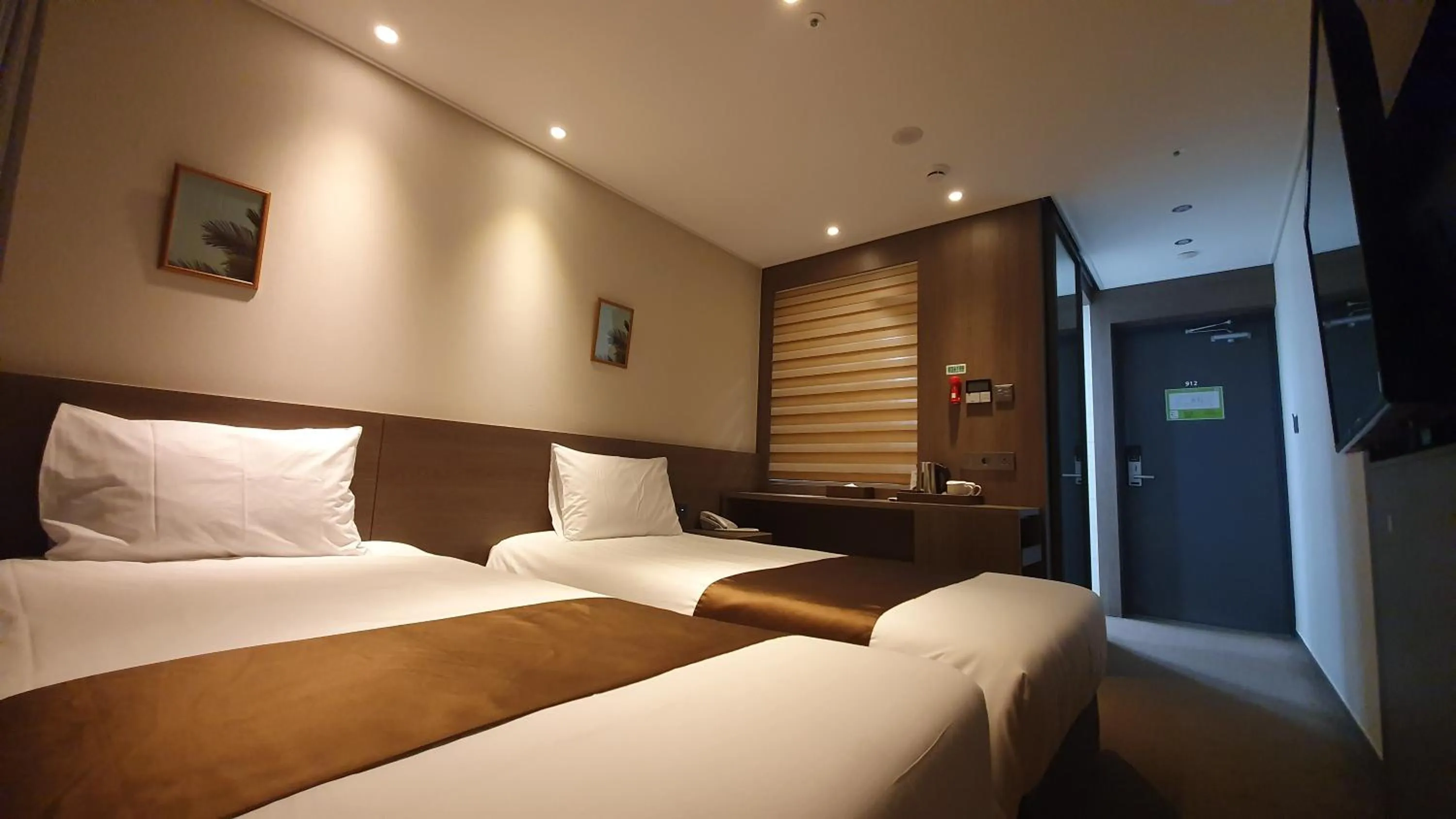 Bed in Grandmillions Hotel Seogwipo