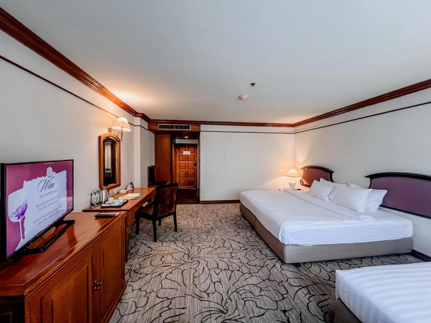 Bed in The Twin Lotus Hotel